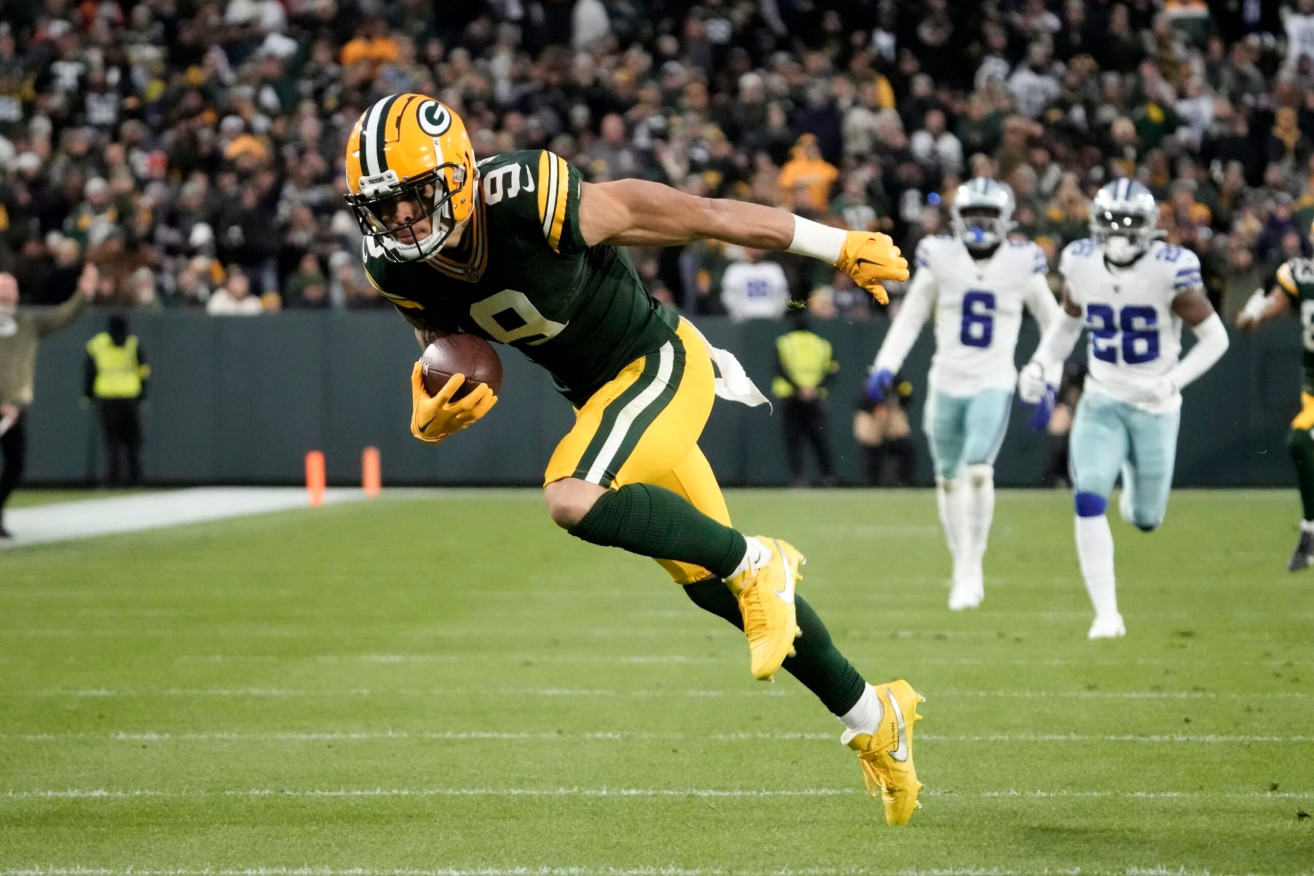 Green Bay Packers wide receiver Christian Watson (9) sprints to the end zone after catching a long pass for a touchdown during the first half of an NFL football game against the Dallas Cowboys Sunday, Nov. 13, 2022, in Green Bay, Wis. (AP Photo/Morry Gash) Green Bay Packers wide receiver Christian Watson (9) sprints to the end zone after catching a long pass for a touchdown during the first half of an NFL football game against the Dallas Cowboys Sunday, Nov. 13, 2022, in Green Bay, Wis. (AP Photo/Morry Gash)