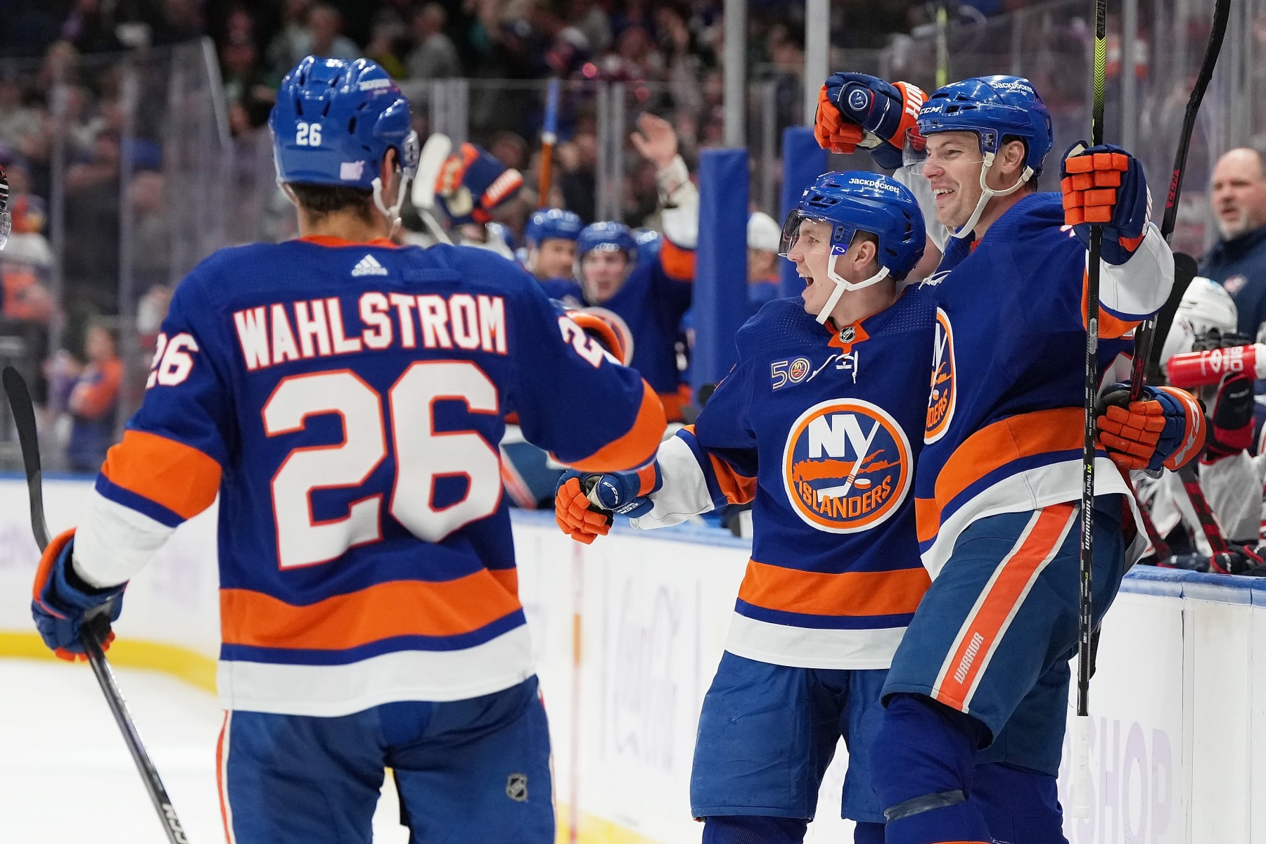 ELMONT, NEW YORK - NOVEMBER 12: Scott Mayfield #24 of the New York Islanders celebrates his third period goal with Sebastian Aho #25 against the Columbus Blue Jackets at UBS Arena on November 12, 2022 in Elmont, New York. (Photo by Dennis DaSilva/NHLI via Getty Images)