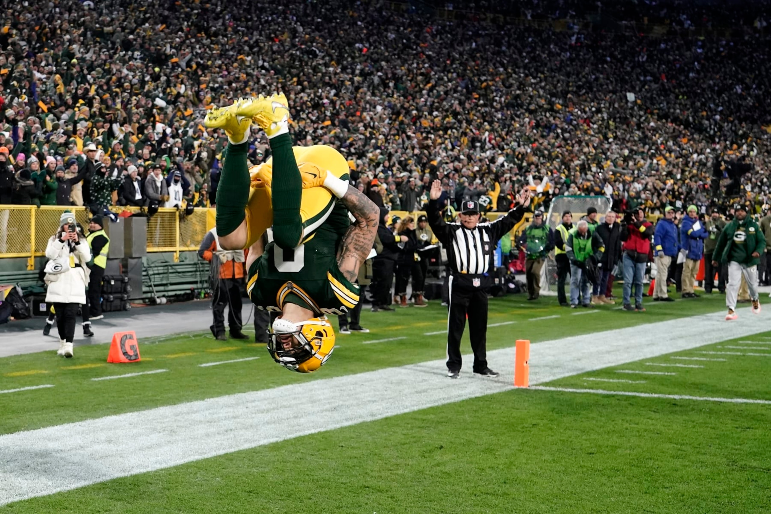 Green Bay Packers wide receiver Christian Watson (9) celebrates catching a pass for a touchdown during the first half of an NFL football game against the Dallas Cowboys Sunday, Nov. 13, 2022, in Green Bay, Wis. (AP Photo/Morry Gash)
