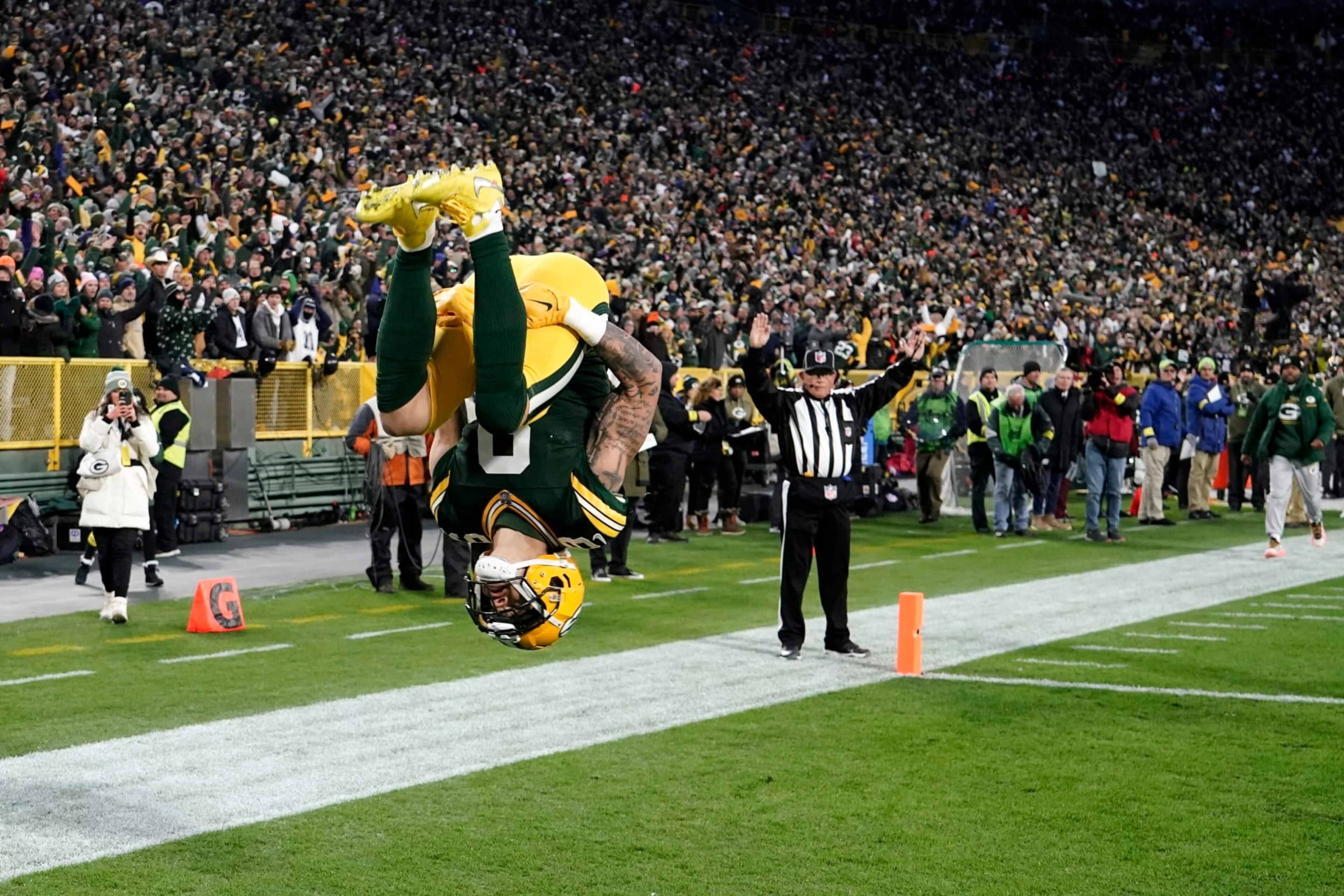 Green Bay Packers wide receiver Christian Watson (9) celebrates catching a pass for a touchdown during the first half of an NFL football game against the Dallas Cowboys Sunday, Nov. 13, 2022, in Green Bay, Wis. (AP Photo/Morry Gash)