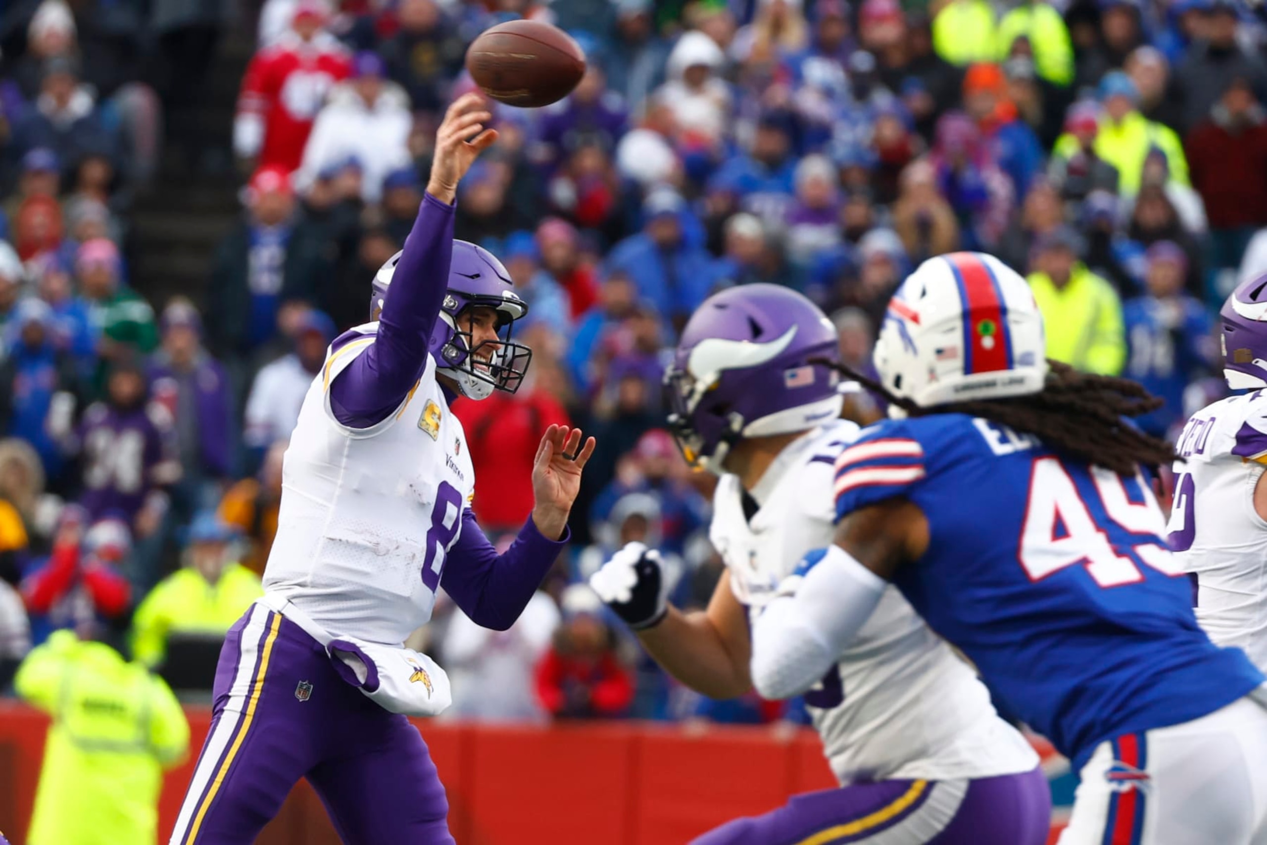 Minnesota Vikings quarterback Kirk Cousins passes under pressure form Buffalo Bills linebacker Tremaine Edmunds in the first half of an NFL football game, Sunday, Nov. 13, 2022, in Orchard Park, N.Y. (AP Photo/Jeffrey T. Barnes)