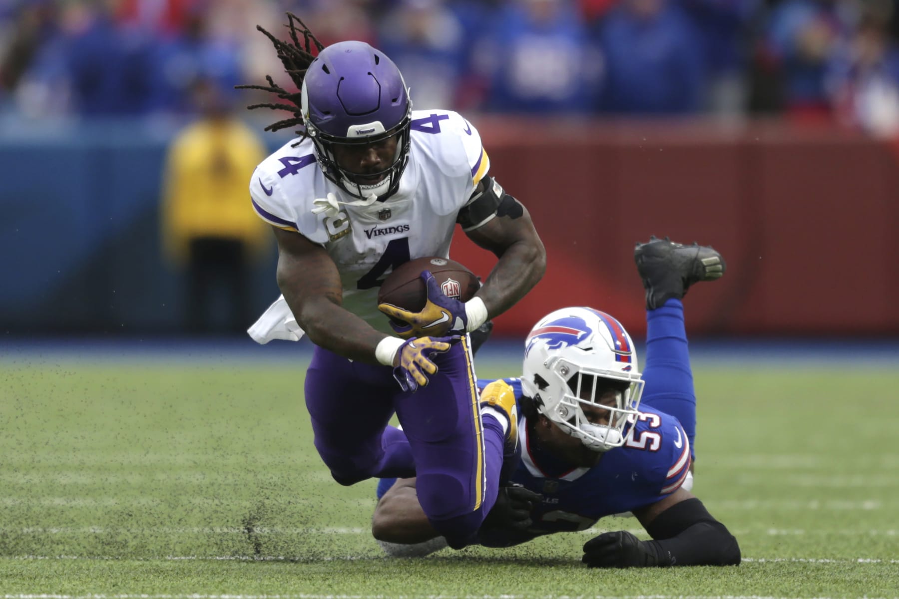 Minnesota Vikings running back Dalvin Cook (4) is brought down by Buffalo Bills linebacker Tyrel Dodson (53) in the first half of an NFL football game, Sunday, Nov. 13, 2022, in Orchard Park, N.Y. (AP Photo/Joshua Bessex)