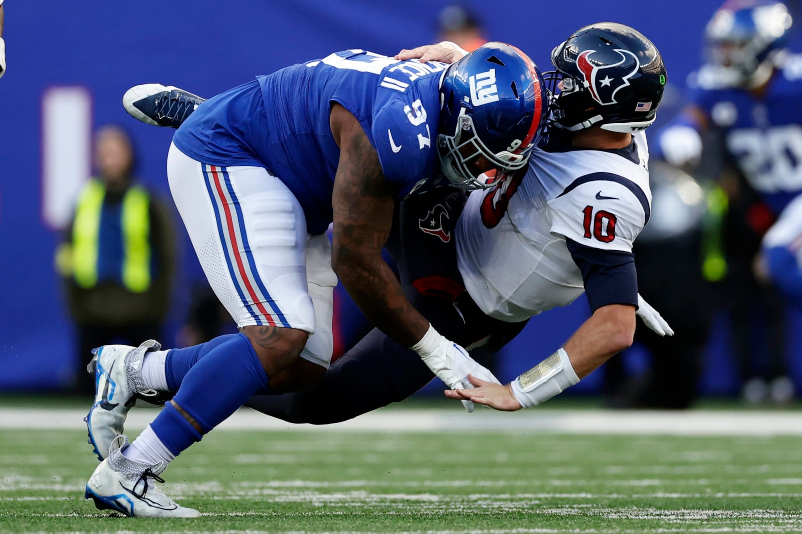 Dexter Lawrence hits Texans QB Davis Mills. Dexter Lawrence hits Texans QB Davis Mills.