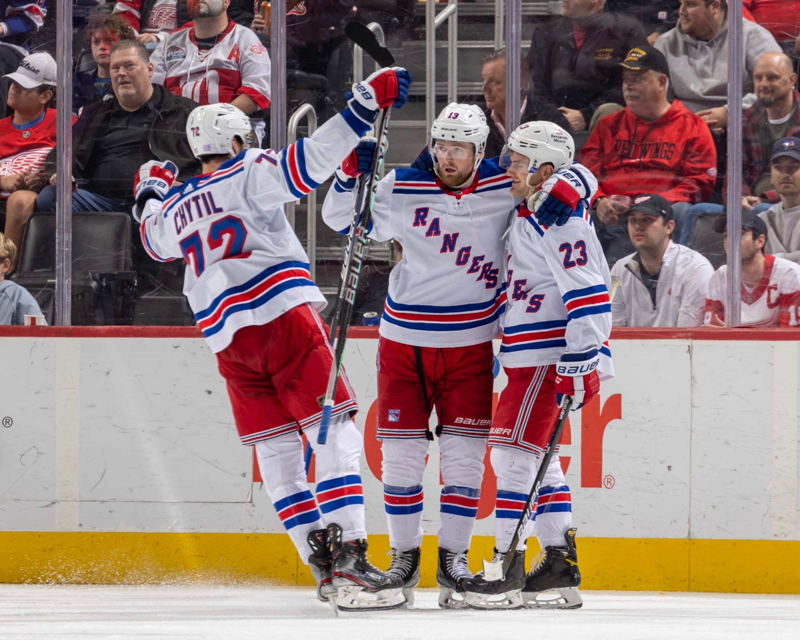 DETROIT, MI - NOVEMBER 10: Alexis Lafrenière #13 and Filip Chytil #72 of the New York Rangers congratulate teammate Adam Fox #23 after he scores a goal during the third period of an NHL game against the Detroit Red Wings at Little Caesars Arena on November 10, 2022 in Detroit, Michigan. New York defeated Detroit 8-2. (Photo by Dave Reginek/NHLI via Getty Images) DETROIT, MI - NOVEMBER 10: Alexis Lafrenière #13 and Filip Chytil #72 of the New York Rangers congratulate teammate Adam Fox #23 after he scores a goal during the third period of an NHL game against the Detroit Red Wings at Little Caesars Arena on November 10, 2022 in Detroit, Michigan. New York defeated Detroit 8-2. (Photo by Dave Reginek/NHLI via Getty Images)