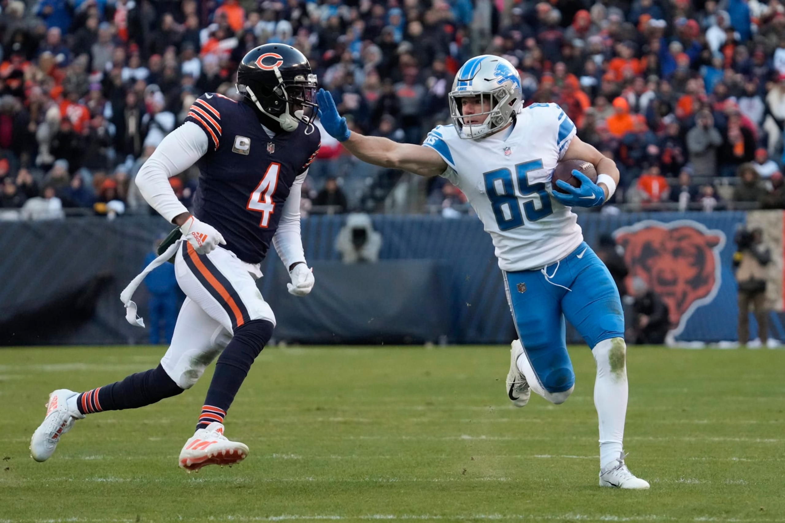 Detroit Lions wide receiver Tom Kennedy (85) stiff arms Chicago Bears safety Eddie Jackson (4) during the second half of an NFL football game in Chicago, Sunday, Nov. 13, 2022. (AP Photo/Nam Y. Huh) Detroit Lions wide receiver Tom Kennedy (85) stiff arms Chicago Bears safety Eddie Jackson (4) during the second half of an NFL football game in Chicago, Sunday, Nov. 13, 2022. (AP Photo/Nam Y. Huh)