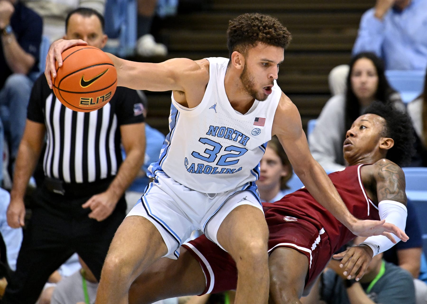 CHAPEL HILL, NORTH CAROLINA - NOVEMBER 11:  Pete Nance #32 of the North Carolina Tar Heels drives against Raekwon Horton #5 of the Charleston Cougars during the first half of their game at the Dean E. Smith Center on November 11, 2022 in Chapel Hill, North Carolina. (Photo by Grant Halverson/Getty Images)