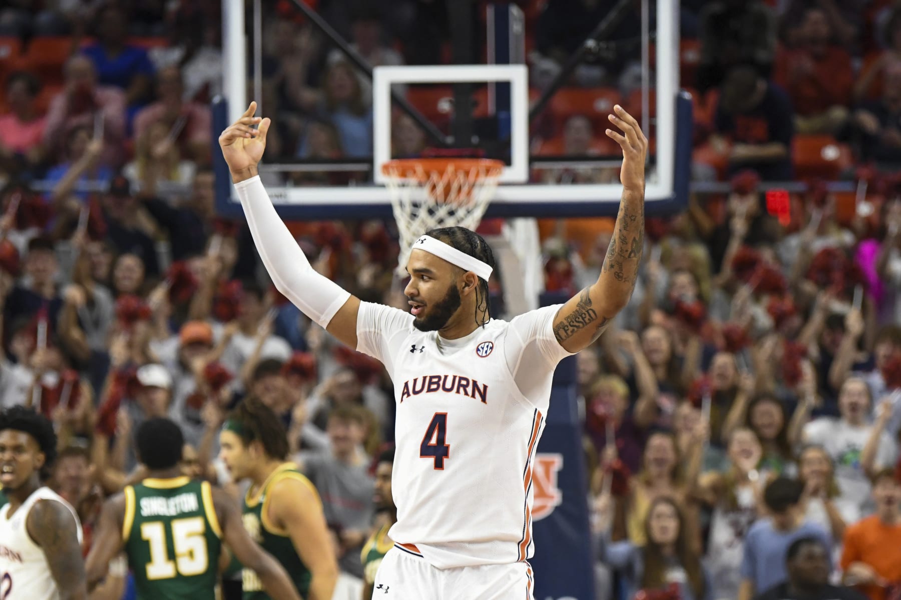 Auburn forward Johni Broome (4) celebrates a basket against George Mason during the first half of an NCAA college basketball game against George Mason, Monday, Nov. 7, 2022, in Auburn, Ala. (AP Photo/Julie Bennett)