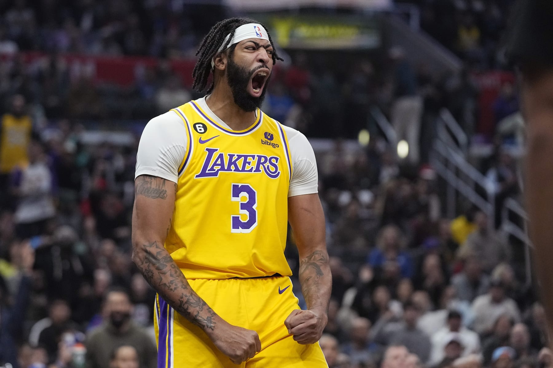 Los Angeles Lakers forward Anthony Davis celebrates after scoring during the first half of an NBA basketball game against the Los Angeles Clippers Wednesday, Nov. 9, 2022, in Los Angeles. (AP Photo/Mark J. Terrill)