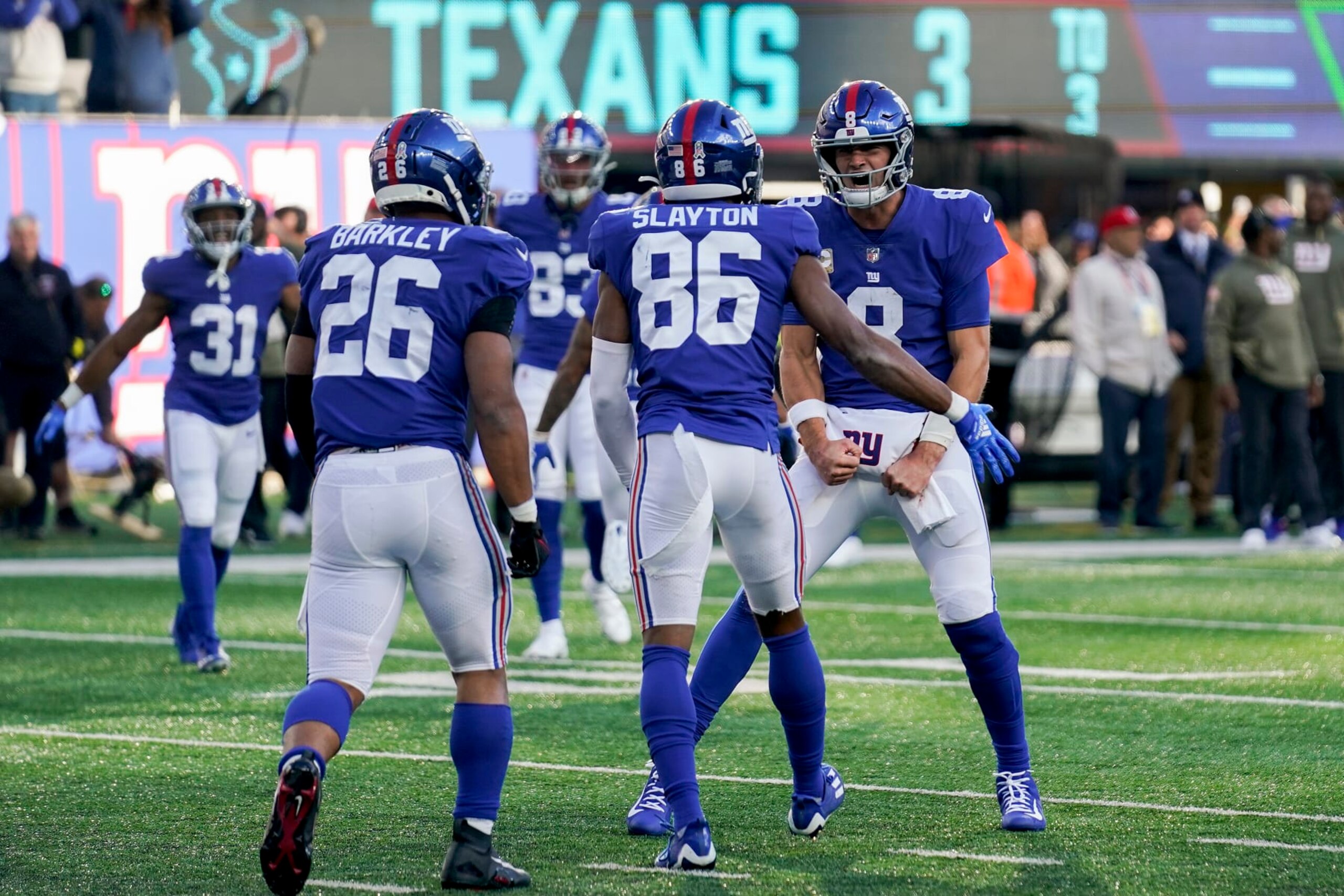 New York Giants quarterback Daniel Jones (8) celebrates with New York Giants wide receiver Darius Slayton (86) after Slayton scored a touchdown against the Houston Texans during the third quarter of an NFL football game, Sunday, Nov. 13, 2022, in East Rutherford, N.J. (AP Photo/Seth Wenig)