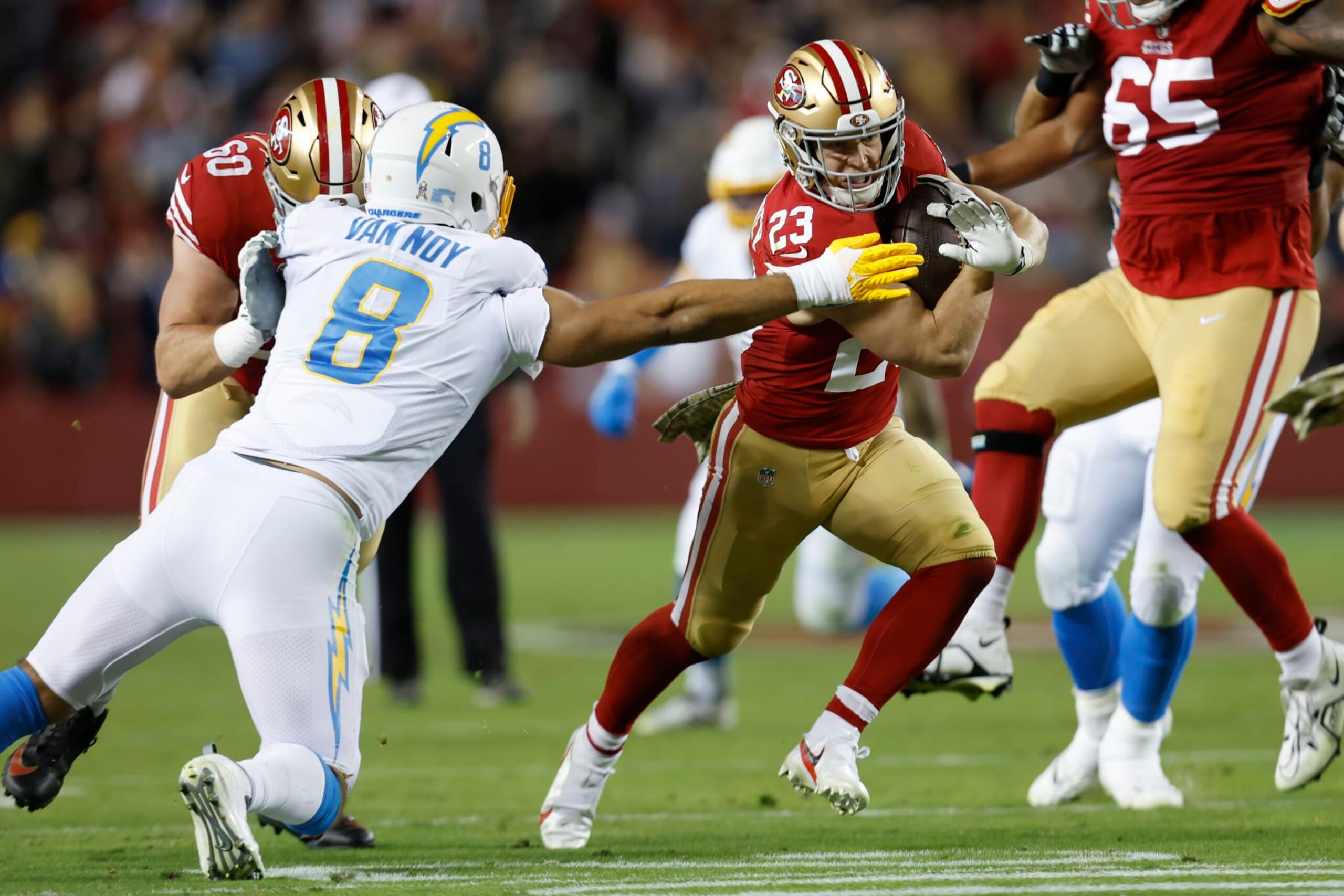 San Francisco 49ers running back Christian McCaffrey (23) runs against Los Angeles Chargers linebacker Kyle Van Noy (8) during the first half of an NFL football game in Santa Clara, Calif., Sunday, Nov. 13, 2022. (AP Photo/Jed Jacobsohn)