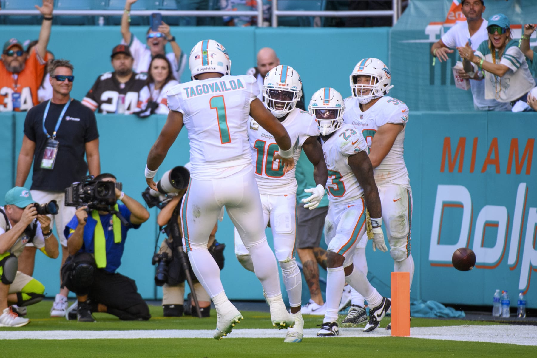 Miami Dolphins wide receiver Tyreek Hill (10) smiles after scoring a touchdown and celebrates with Miami Dolphins quarterback Tua Tagovailoa (1) during an NFL football game against the Cleveland Browns, Sunday, Nov. 13, 2022, in Miami Gardens, Fla. (AP Photo/Doug Murray)