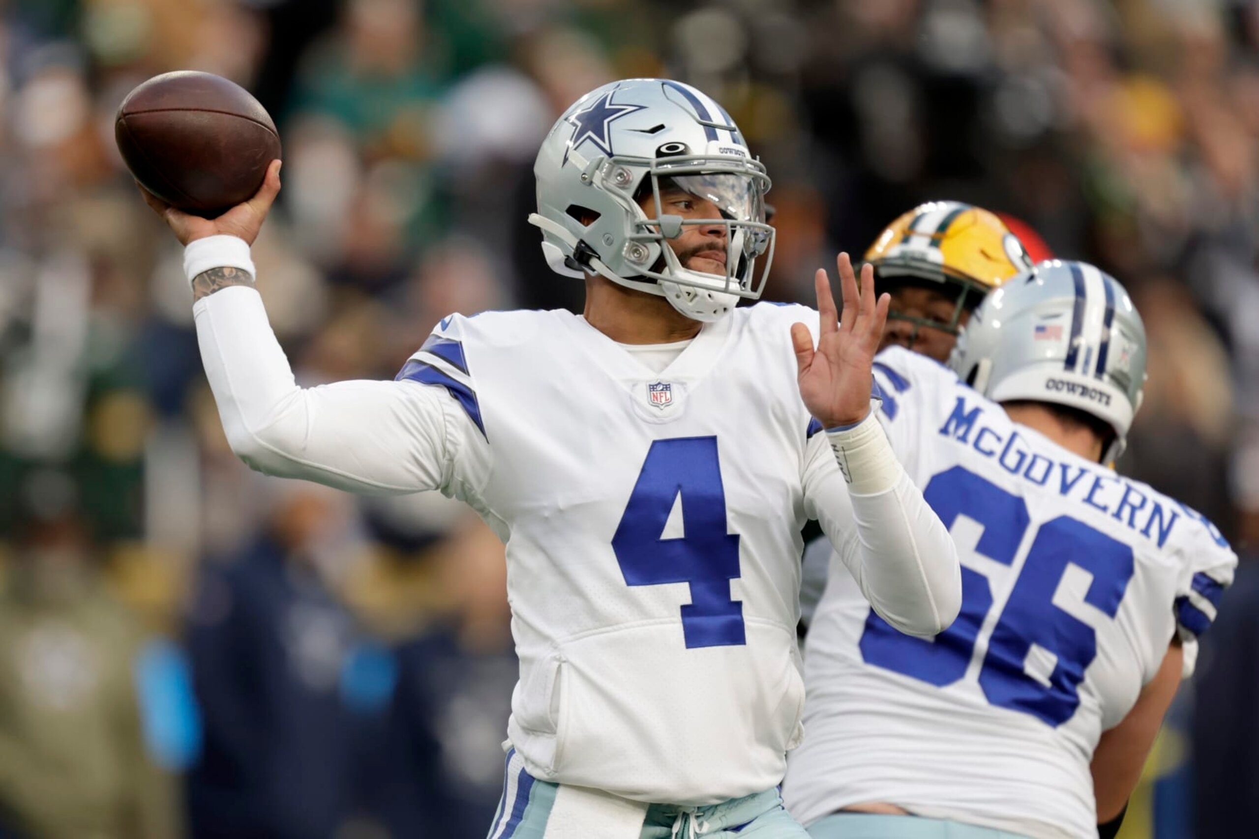 Dallas Cowboys quarterback Dak Prescott (4) throws a pass during the first half of an NFL football game against the Green Bay Packers Sunday, Nov. 13, 2022, in Green Bay, Wis. (AP Photo/Matt Ludtke)