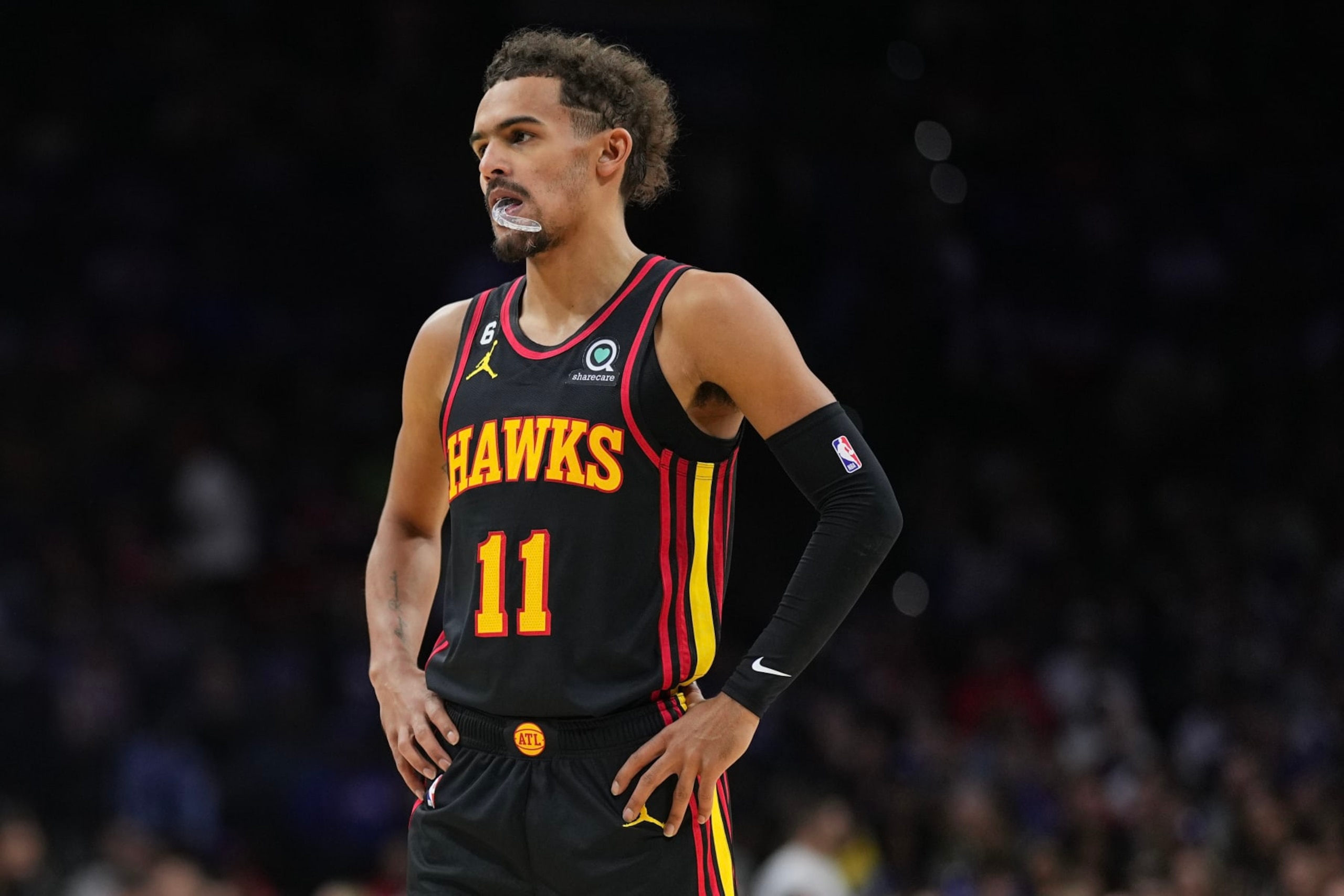 PHILADELPHIA, PA - NOVEMBER 12: Trae Young #11 of the Atlanta Hawks looks on against the Philadelphia 76ers at the Wells Fargo Center on November 12, 2022 in Philadelphia, Pennsylvania. NOTE TO USER: User expressly acknowledges and agrees that, by downloading and or using this photograph, User is consenting to the terms and conditions of the Getty Images License Agreement. (Photo by Mitchell Leff/Getty Images) PHILADELPHIA, PA - NOVEMBER 12: Trae Young #11 of the Atlanta Hawks looks on against the Philadelphia 76ers at the Wells Fargo Center on November 12, 2022 in Philadelphia, Pennsylvania. NOTE TO USER: User expressly acknowledges and agrees that, by downloading and or using this photograph, User is consenting to the terms and conditions of the Getty Images License Agreement. (Photo by Mitchell Leff/Getty Images)