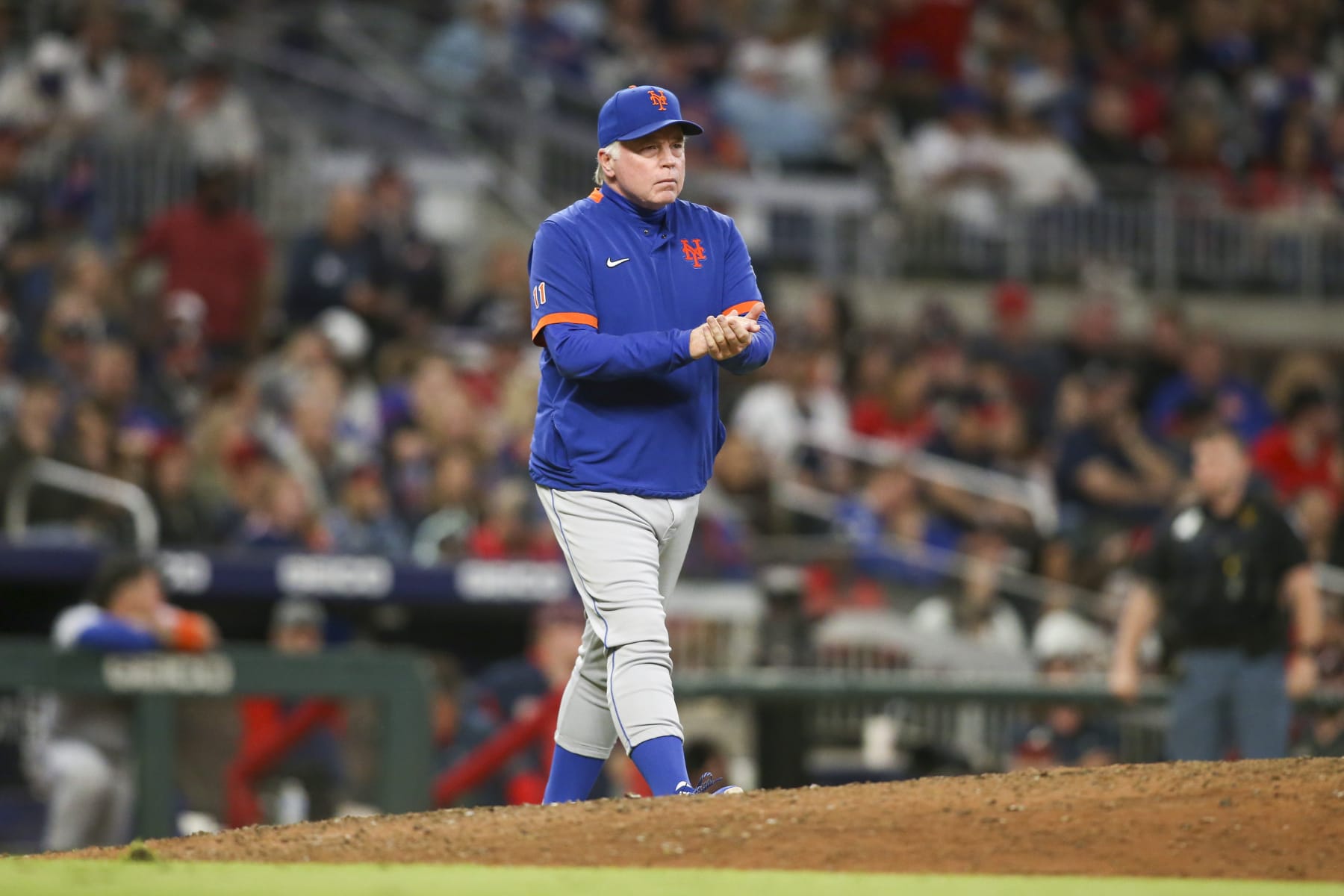 New York Mets manager Buck Showalter (11) makes a pitching change in the eighth inning of a baseball game against the Atlanta Braves, Saturday, Oct. 1, 2022, in Atlanta. (AP Photo/Brett Davis)