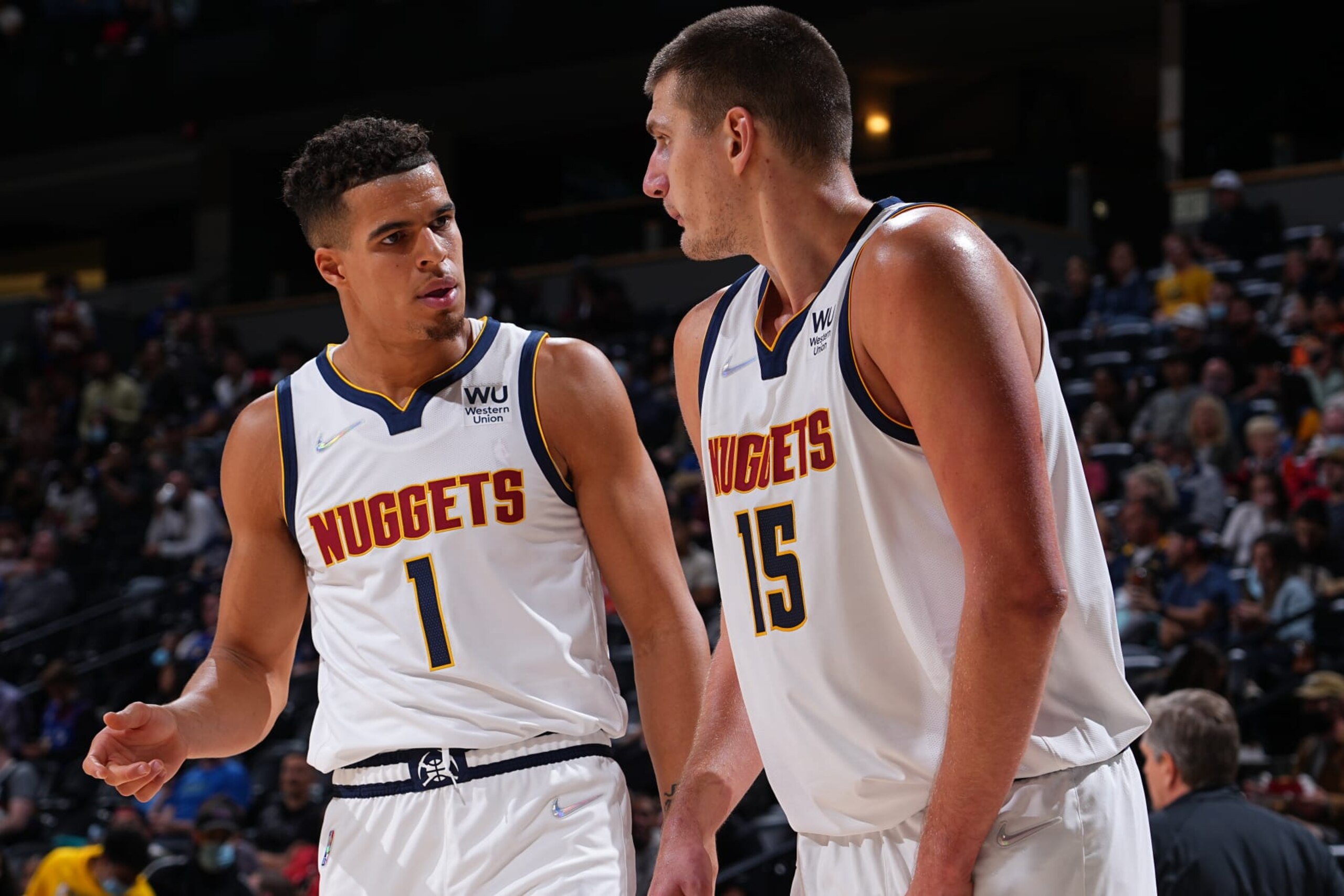 DENVER, CO - OCTOBER 8: Michael Porter Jr. #1 of the Denver Nuggets talks to teammate Nikola Jokic #15 during a preseason game against the Minnesota Timberwolves on October, 2021 at the Ball Arena in Denver, Colorado. NOTE TO USER: User expressly acknowledges and agrees that, by downloading and/or using this Photograph, user is consenting to the terms and conditions of the Getty Images License Agreement. Mandatory Copyright Notice: Copyright 2021 NBAE (Photo by Bart Young/NBAE via Getty Images) DENVER, CO - OCTOBER 8: Michael Porter Jr. #1 of the Denver Nuggets talks to teammate Nikola Jokic #15 during a preseason game against the Minnesota Timberwolves on October, 2021 at the Ball Arena in Denver, Colorado. NOTE TO USER: User expressly acknowledges and agrees that, by downloading and/or using this Photograph, user is consenting to the terms and conditions of the Getty Images License Agreement. Mandatory Copyright Notice: Copyright 2021 NBAE (Photo by Bart Young/NBAE via Getty Images)