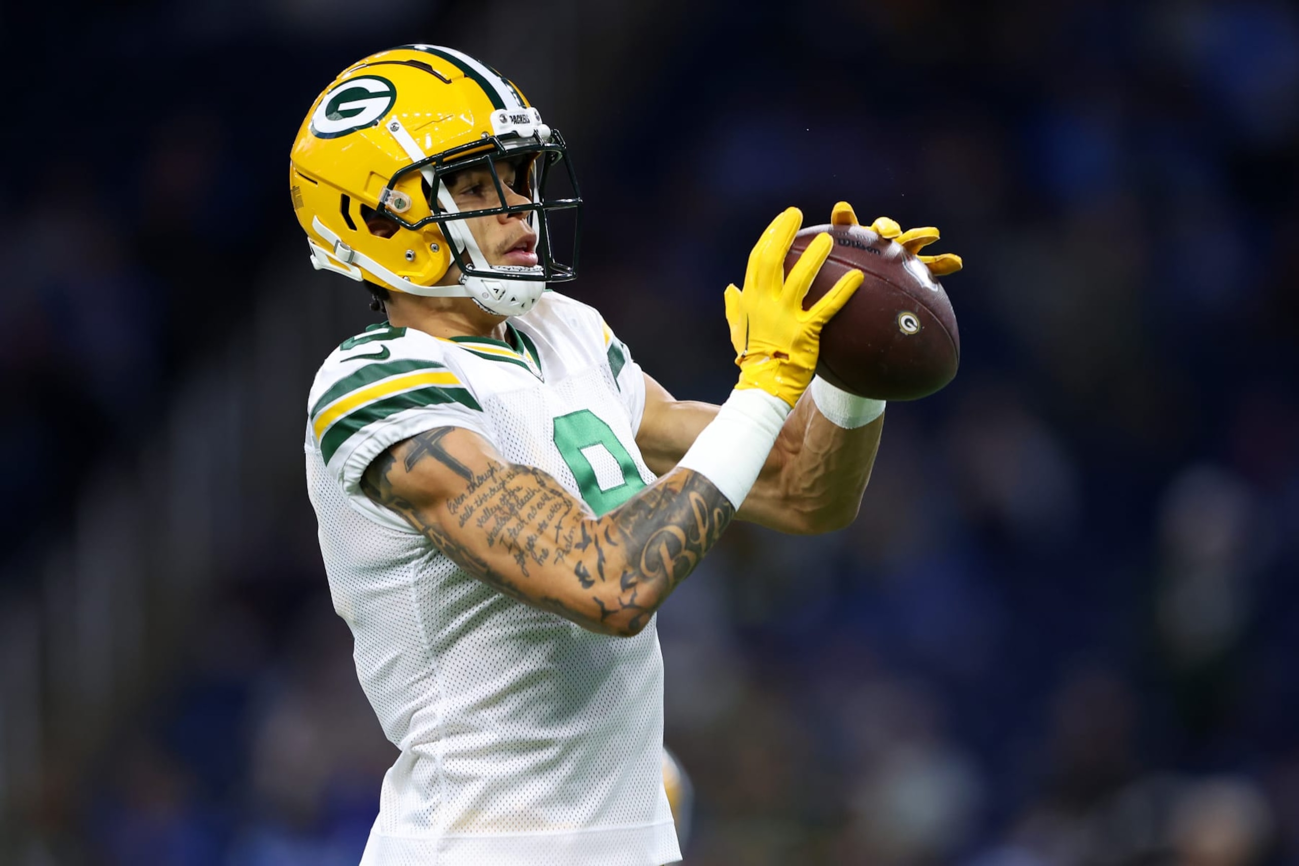 DETROIT, MICHIGAN - NOVEMBER 06: Christian Watson #9 of the Green Bay Packers catches a pass prior to a game against the Detroit Lions at Ford Field on November 06, 2022 in Detroit, Michigan. (Photo by Rey Del Rio/Getty Images)