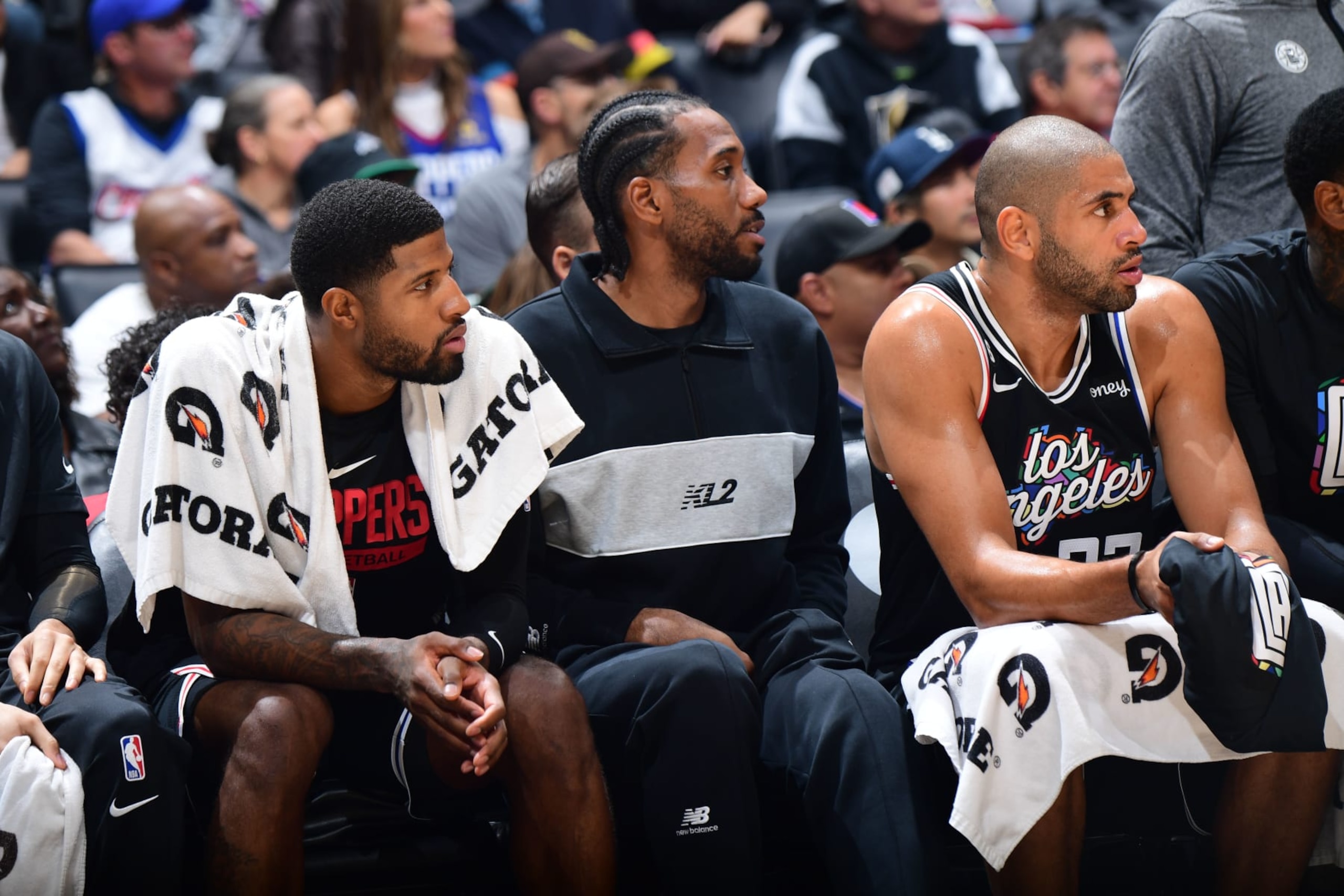LOS ANGELES, CA - NOVEMBER 12: Paul George #13, Kawhi Leonard #2, and Nicolas Batum #33 of the LA Clippers sit on the bench during the game against the Brooklyn Nets on November 12, 2022 at Crypto.com Arena in Los Angeles, California. NOTE TO USER: User expressly acknowledges and agrees that, by downloading and/or using this Photograph, user is consenting to the terms and conditions of the Getty Images License Agreement. Mandatory Copyright Notice: Copyright 2022 NBAE (Photo by Adam Pantozzi/NBAE via Getty Images) LOS ANGELES, CA - NOVEMBER 12: Paul George #13, Kawhi Leonard #2, and Nicolas Batum #33 of the LA Clippers sit on the bench during the game against the Brooklyn Nets on November 12, 2022 at Crypto.com Arena in Los Angeles, California. NOTE TO USER: User expressly acknowledges and agrees that, by downloading and/or using this Photograph, user is consenting to the terms and conditions of the Getty Images License Agreement. Mandatory Copyright Notice: Copyright 2022 NBAE (Photo by Adam Pantozzi/NBAE via Getty Images)