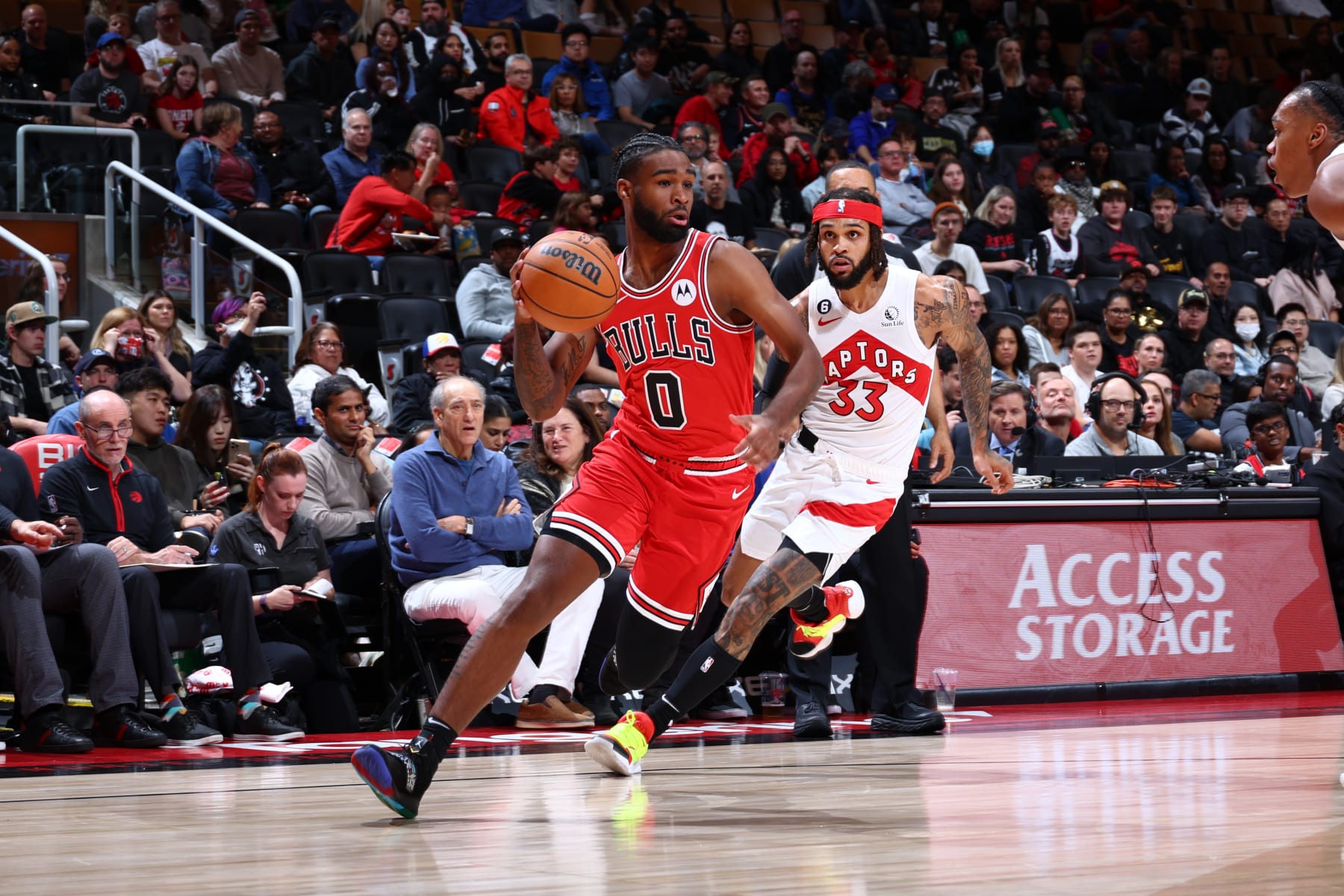 TORONTO, CANADA - OCTOBER 9: Coby White #0 of the Chicago Bulls drives to the basket against the Toronto Raptors during a preseason game on October 9, 2022 at the Scotiabank Arena in Toronto, Ontario, Canada.  NOTE TO USER: User expressly acknowledges and agrees that, by downloading and or using this Photograph, user is consenting to the terms and conditions of the Getty Images License Agreement.  Mandatory Copyright Notice: Copyright 2022 NBAE (Photo by Vaughn Ridley/NBAE via Getty Images)