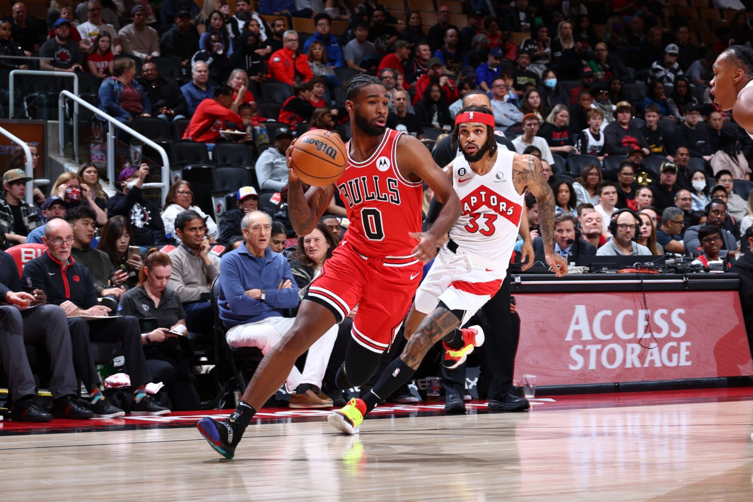 TORONTO, CANADA - OCTOBER 9: Coby White #0 of the Chicago Bulls drives to the basket against the Toronto Raptors during a preseason game on October 9, 2022 at the Scotiabank Arena in Toronto, Ontario, Canada.  NOTE TO USER: User expressly acknowledges and agrees that, by downloading and or using this Photograph, user is consenting to the terms and conditions of the Getty Images License Agreement.  Mandatory Copyright Notice: Copyright 2022 NBAE (Photo by Vaughn Ridley/NBAE via Getty Images)