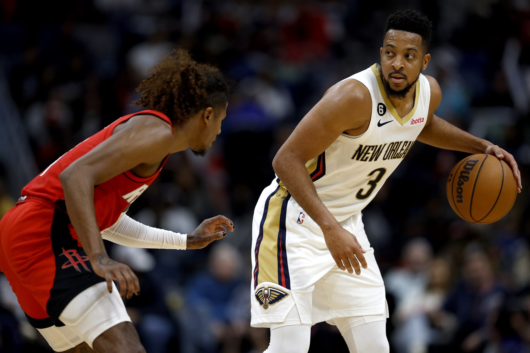 NEW ORLEANS, LOUISIANA - NOVEMBER 12: CJ McCollum #3 of the New Orleans Pelicans is defened by Jalen Green #4 of the Houston Rockets during the second quarter of an NBA game at Smoothie King Center on November 12, 2022 in New Orleans, Louisiana. NOTE TO USER: User expressly acknowledges and agrees that, by downloading and or using this photograph, User is consenting to the terms and conditions of the Getty Images License Agreement. (Photo by Sean Gardner/Getty Images)