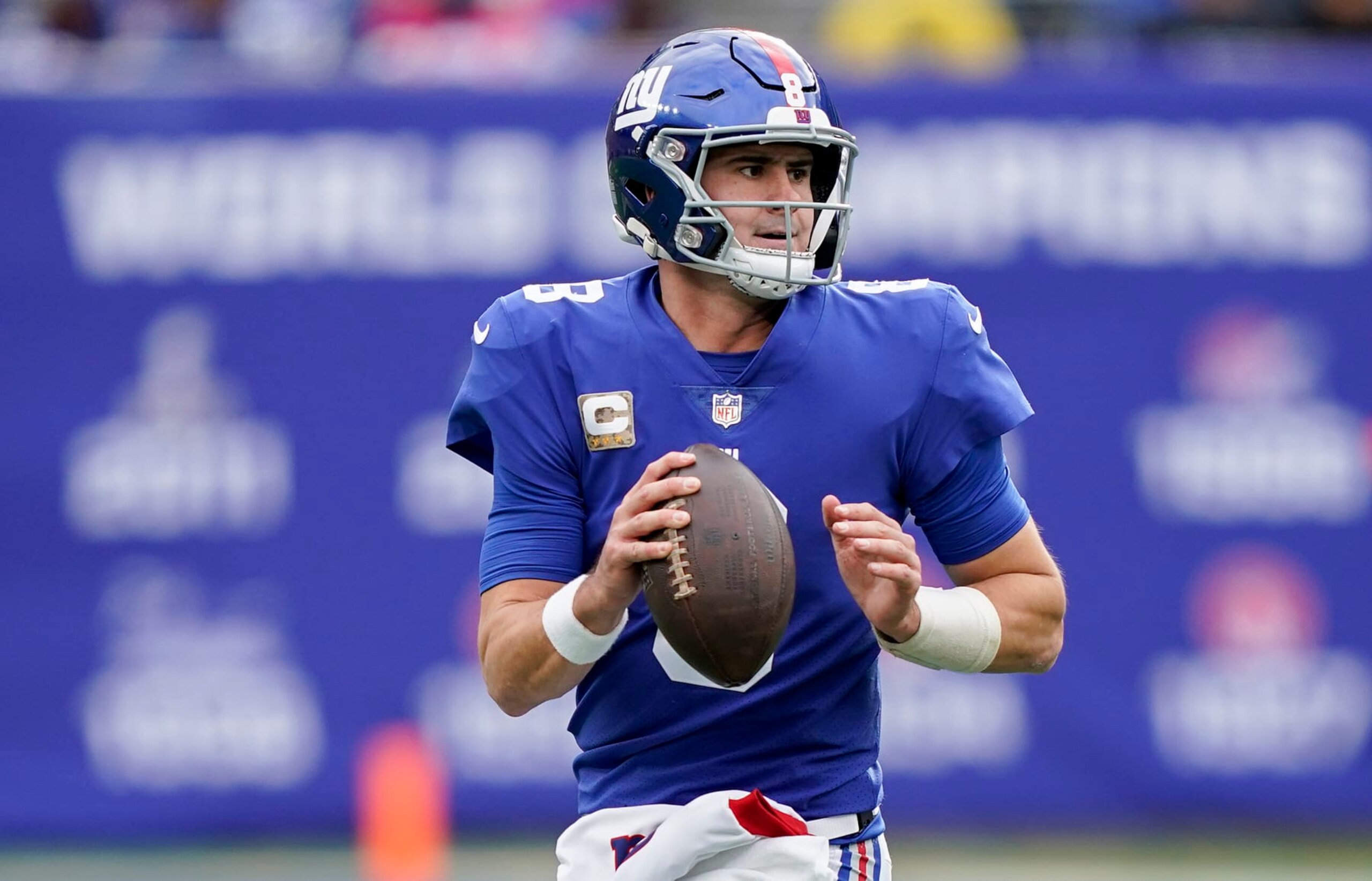 New York Giants quarterback Daniel Jones (8) rolls out of the pocket to pass against the Houston Texans during the second quarter of an NFL football game, Sunday, Nov. 13, 2022, in East Rutherford, N.J. (AP Photo/John Minchillo)