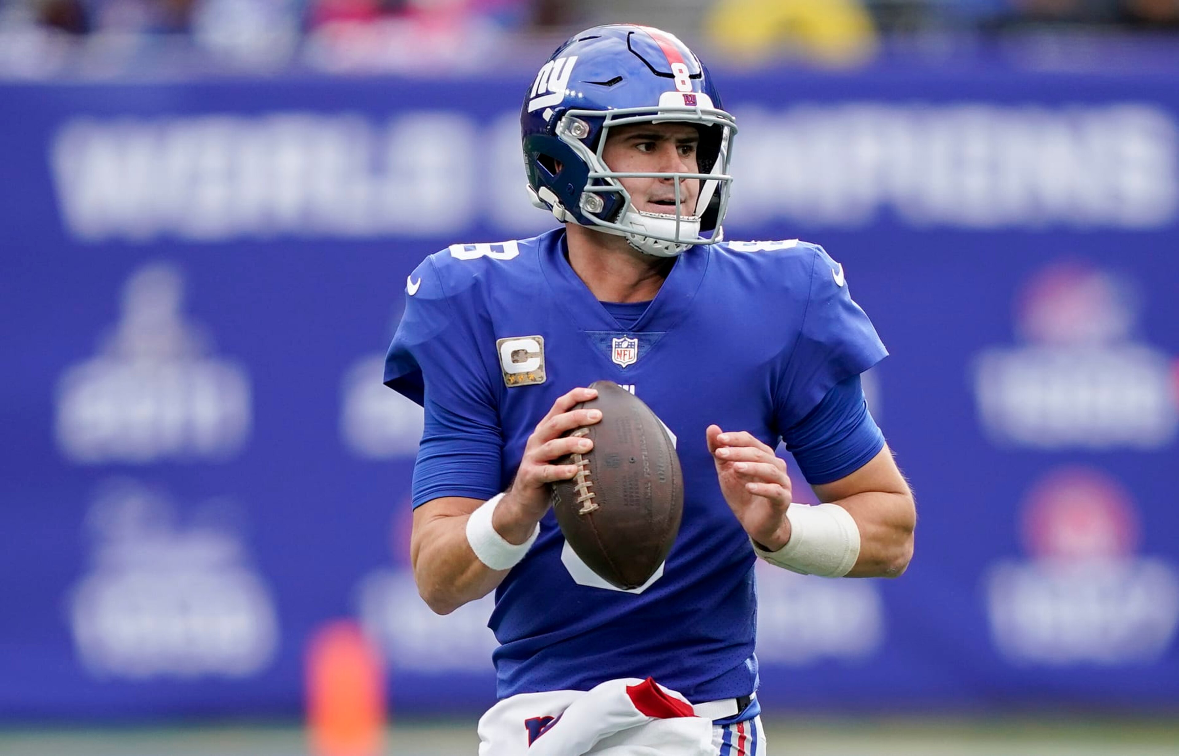 New York Giants quarterback Daniel Jones (8) rolls out of the pocket to pass against the Houston Texans during the second quarter of an NFL football game, Sunday, Nov. 13, 2022, in East Rutherford, N.J. (AP Photo/John Minchillo)