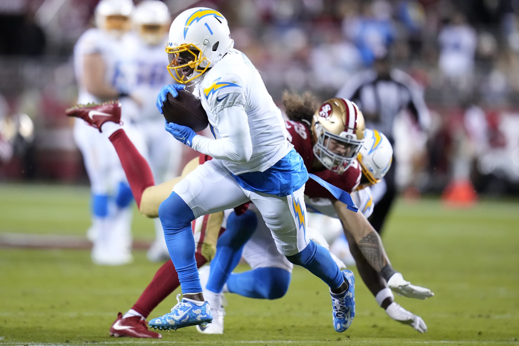 Los Angeles Chargers wide receiver DeAndre Carter (1) runs against San Francisco 49ers safety Talanoa Hufanga during the first half of an NFL football game in Santa Clara, Calif., Sunday, Nov. 13, 2022. (AP Photo/Godofredo A. Vásquez)