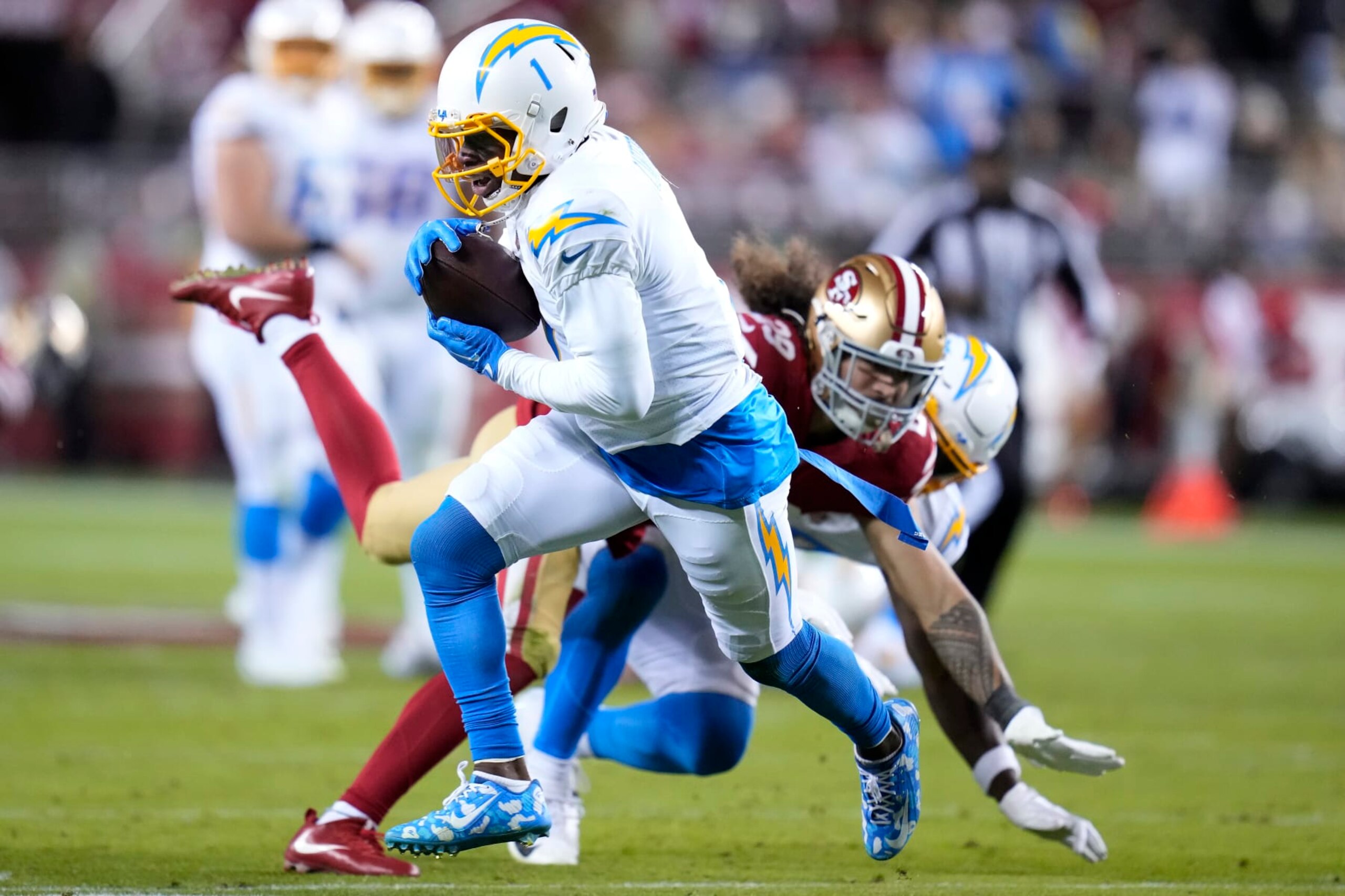 Los Angeles Chargers wide receiver DeAndre Carter (1) runs against San Francisco 49ers safety Talanoa Hufanga during the first half of an NFL football game in Santa Clara, Calif., Sunday, Nov. 13, 2022. (AP Photo/Godofredo A. Vásquez)