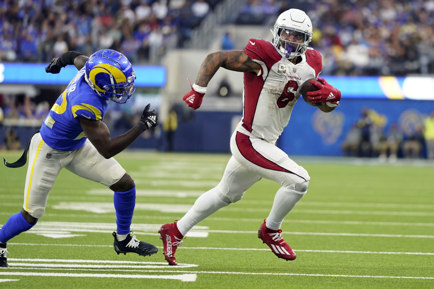 Arizona Cardinals running back James Conner (6) runs for a touchdown past Los Angeles Rams cornerback David Long Jr. during the second half of an NFL football game Sunday, Nov. 13, 2022, in Inglewood, Calif. (AP Photo/Jae C. Hong)