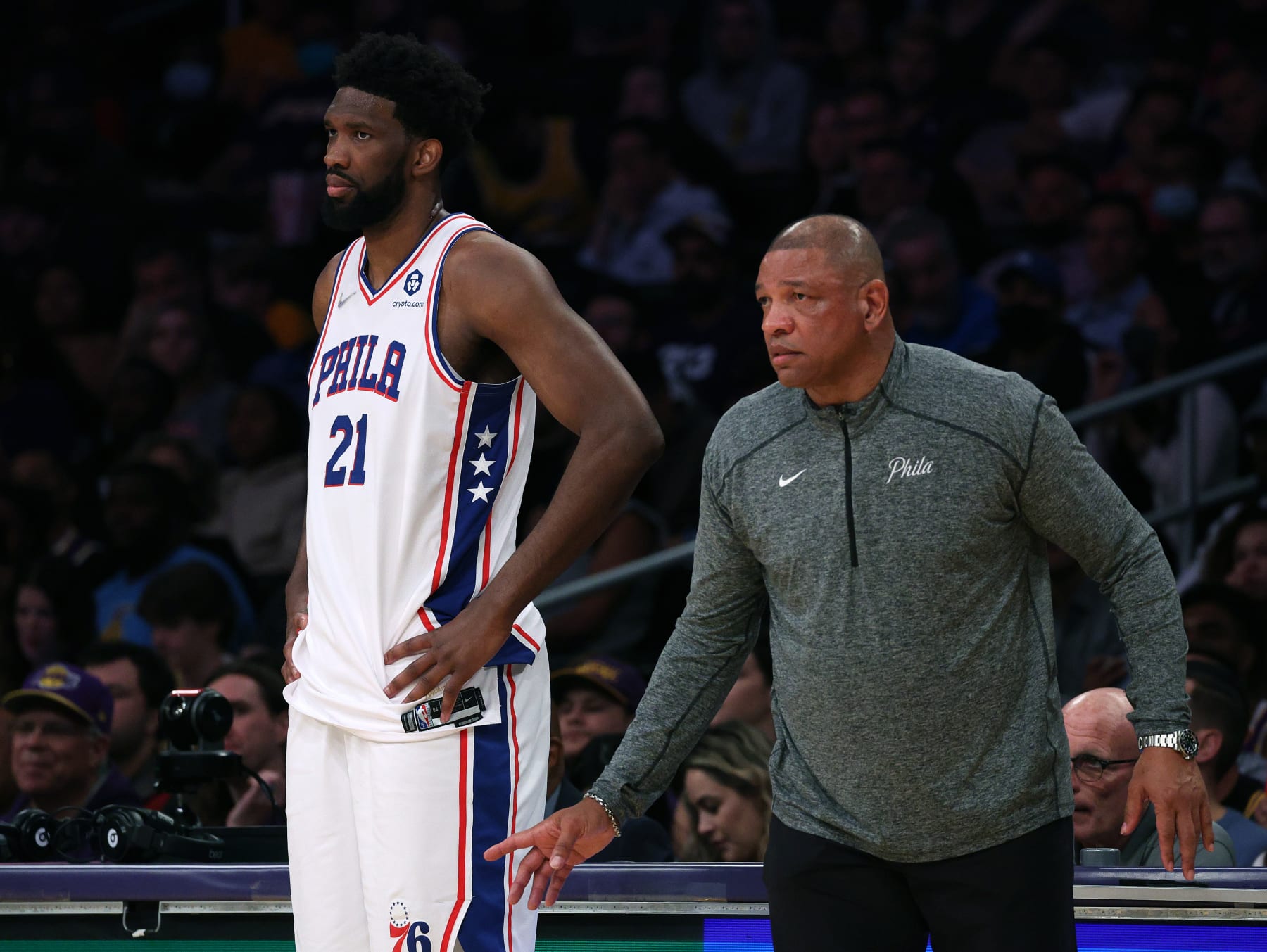 LOS ANGELES, CALIFORNIA - MARCH 23: Head coach Doc Rivers and Joel Embiid #21 of the Philadelphia 76ers watch from the sidelines during a 126-121 win over the Los Angeles Lakers at Crypto.com Arena on March 23, 2022 in Los Angeles, California. (Photo by Harry How/Getty Images) NOTE TO USER: User expressly acknowledges and agrees that, by downloading and/or using this Photograph, user is consenting to the terms and conditions of the Getty Images License Agreement. Mandatory Copyright Notice: Copyright 2022 NBAE