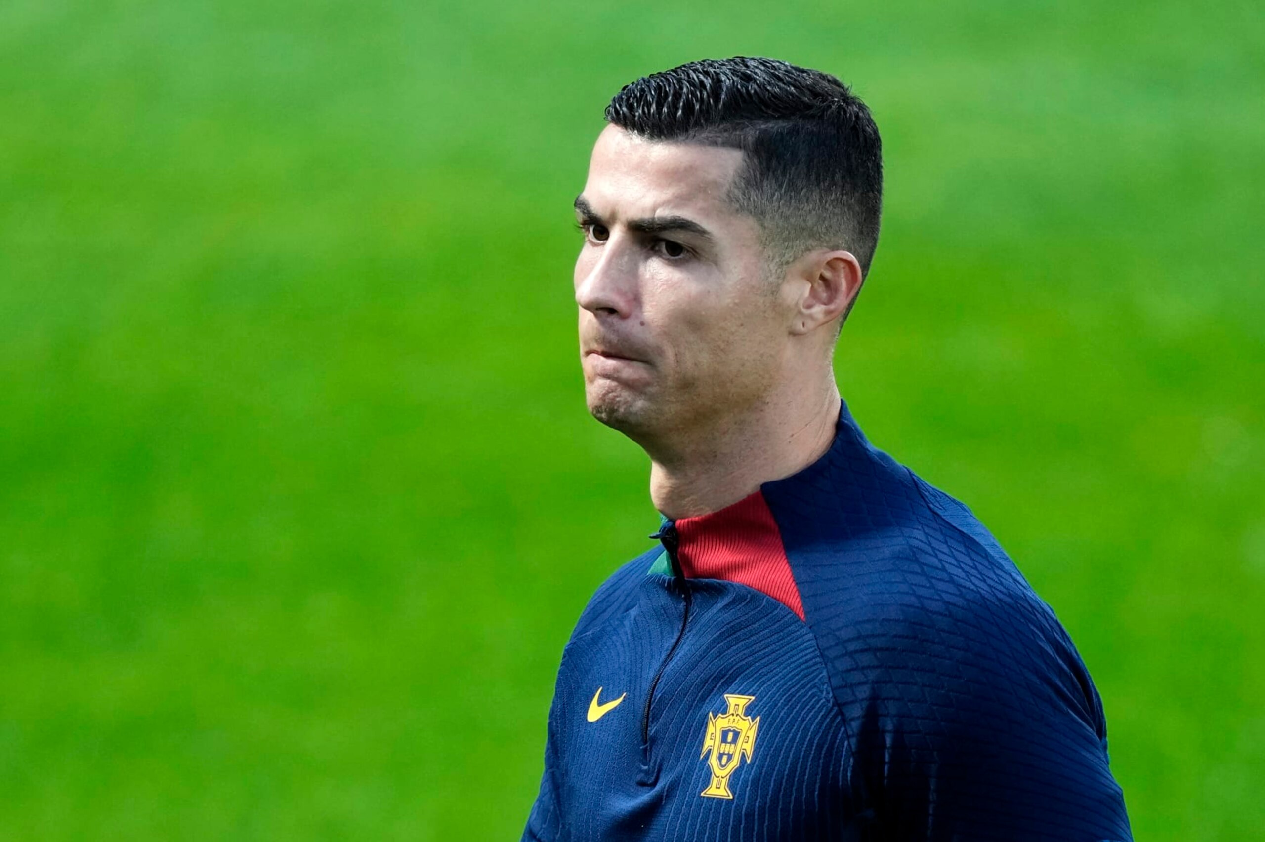 Cristiano Ronaldo walks on the pitch during a Portugal soccer team training in Oeiras, outside Lisbon, Monday, Nov. 14, 2022. Portugal will play Nigeria Thursday in a friendly match in Lisbon before departing to Qatar on Friday for the World Cup. (AP Photo/Armando Franca)