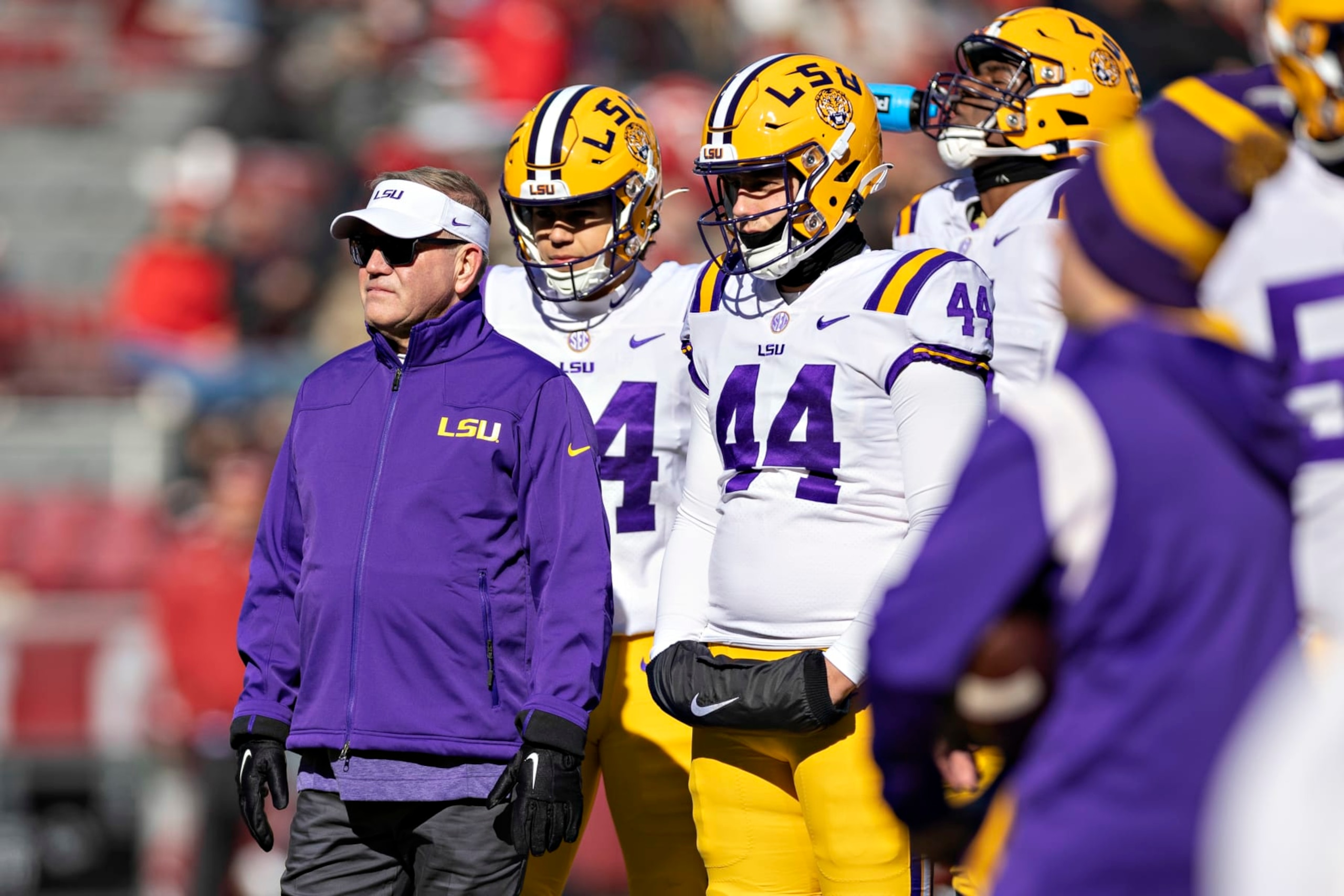 FAYETTEVILLE, ARKANSAS - NOVEMBER 12: Head Coach Brian Kelly of the LSU Tigers watches his team warm up before a game against the Arkansas Razorbacks at Donald W. Reynolds Razorback Stadium on November 12, 2022 in Fayetteville, Arkansas. The Tigers defeated the Razorbacks 13-10. (Photo by Wesley Hitt/Getty Images) FAYETTEVILLE, ARKANSAS - NOVEMBER 12: Head Coach Brian Kelly of the LSU Tigers watches his team warm up before a game against the Arkansas Razorbacks at Donald W. Reynolds Razorback Stadium on November 12, 2022 in Fayetteville, Arkansas. The Tigers defeated the Razorbacks 13-10. (Photo by Wesley Hitt/Getty Images)