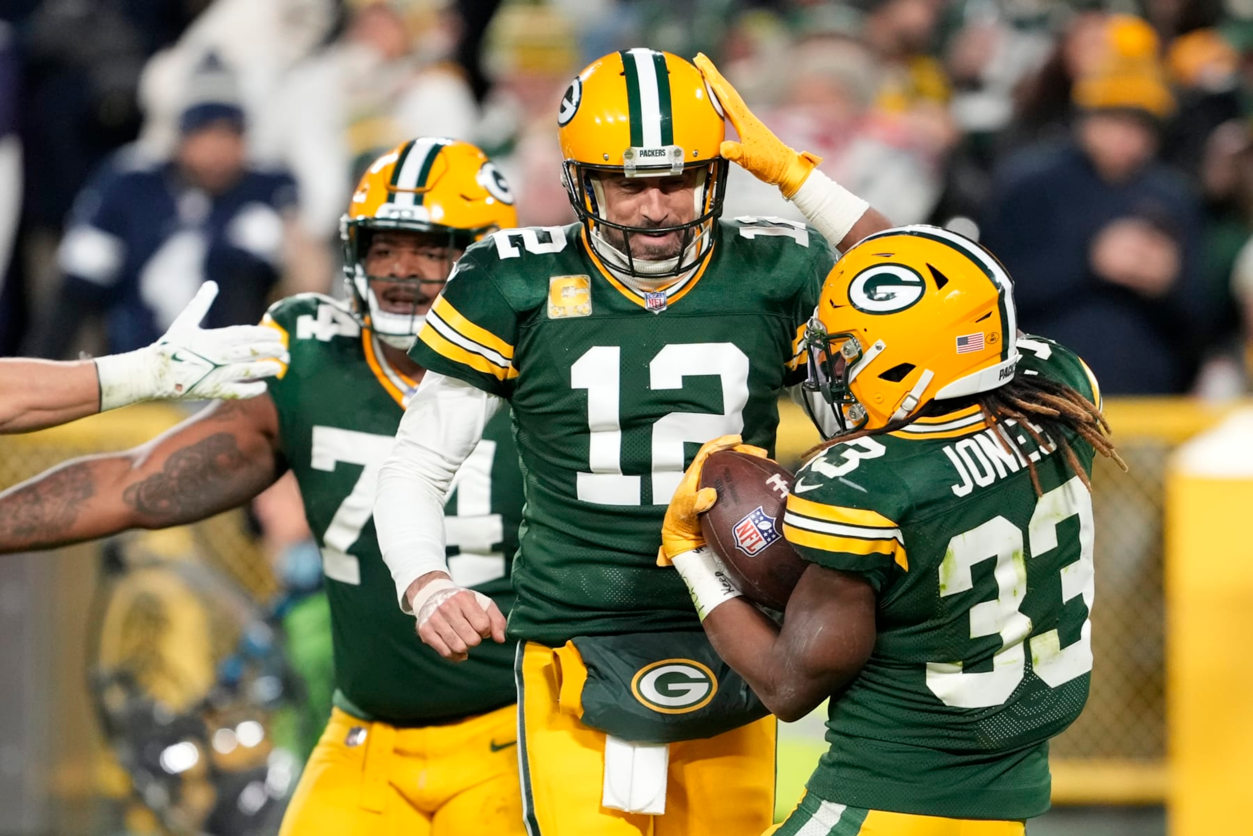 GREEN BAY, WISCONSIN - NOVEMBER 13: Aaron Rodgers #12 of the Green Bay Packers celebrates with Aaron Jones #33 of the Green Bay Packers after Jones' touchdown during the second quarter against the Dallas Cowboys at Lambeau Field on November 13, 2022 in Green Bay, Wisconsin. (Photo by Patrick McDermott/Getty Images) GREEN BAY, WISCONSIN - NOVEMBER 13: Aaron Rodgers #12 of the Green Bay Packers celebrates with Aaron Jones #33 of the Green Bay Packers after Jones' touchdown during the second quarter against the Dallas Cowboys at Lambeau Field on November 13, 2022 in Green Bay, Wisconsin. (Photo by Patrick McDermott/Getty Images)