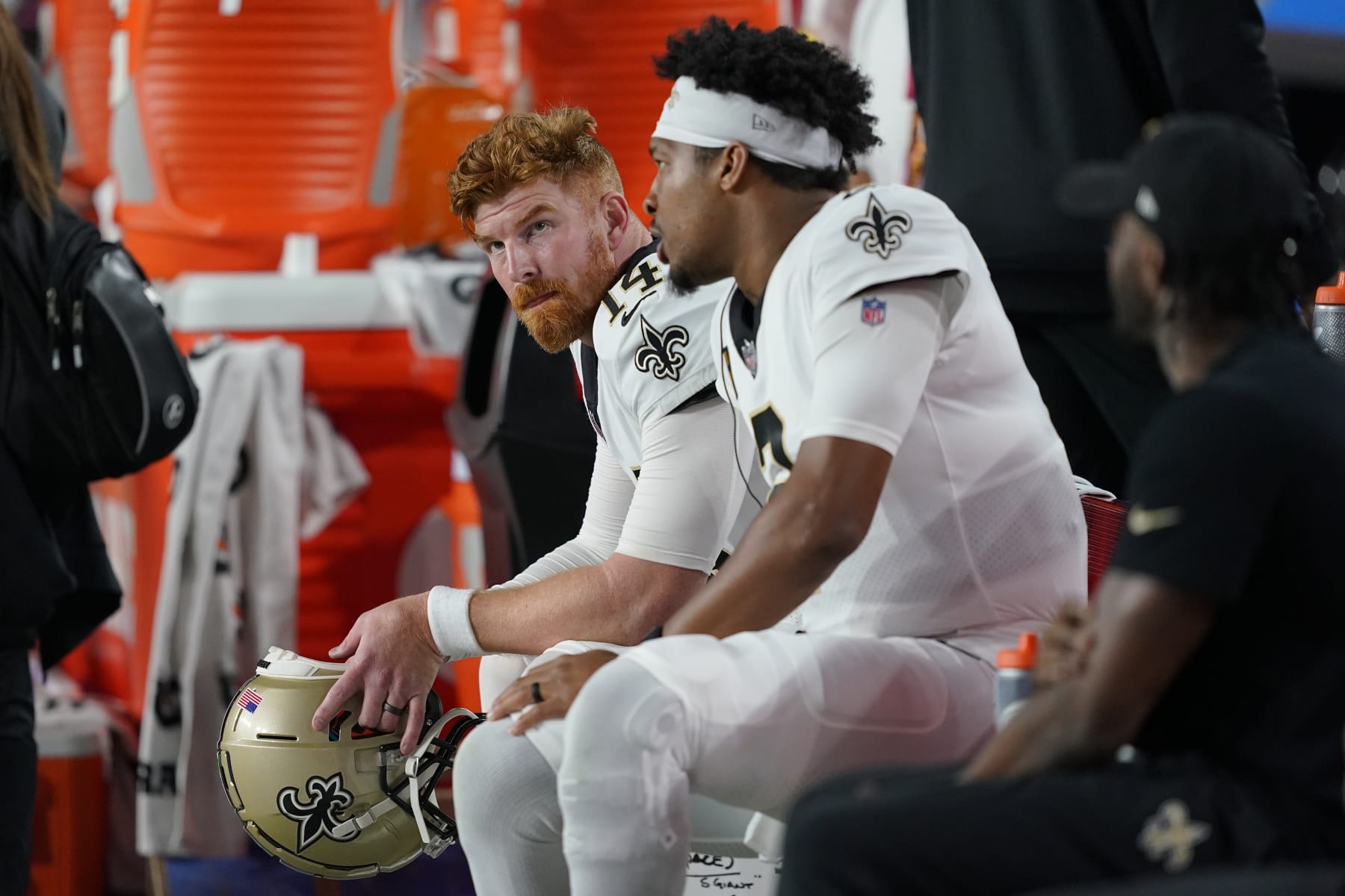 New Orleans Saints quarterback Andy Dalton, left, and quarterback Jameis Winston watch during the second half of an NFL football game against the Arizona Cardinals, Thursday, Oct. 20, 2022, in Glendale, Ariz. (AP Photo/Matt York)
