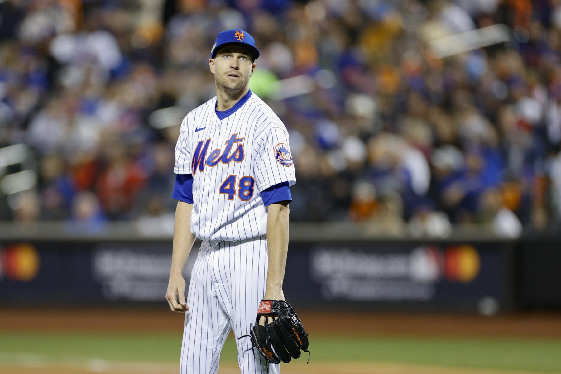 NEW YORK, NEW YORK - OCTOBER 08: Jacob deGrom #48 of the New York Mets reacts to giving up a solo home run to Trent Grisham #2 of the San Diego Padres during the third inning in game two of the Wild Card Series at Citi Field on October 08, 2022 in New York City. (Photo by Sarah Stier/Getty Images)