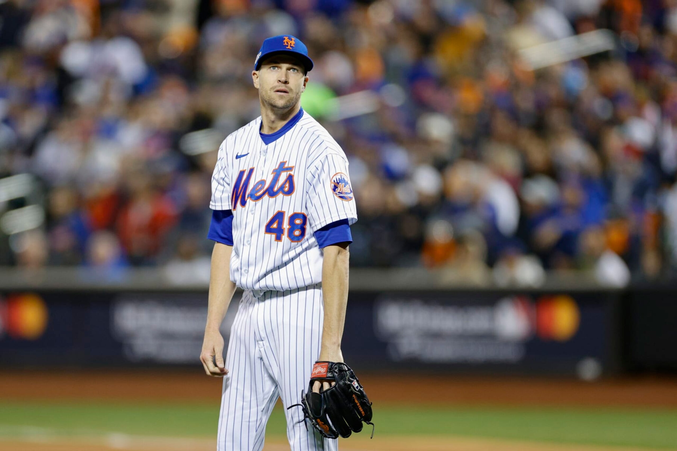 NEW YORK, NEW YORK - OCTOBER 08: Jacob deGrom #48 of the New York Mets reacts to giving up a solo home run to Trent Grisham #2 of the San Diego Padres during the third inning in game two of the Wild Card Series at Citi Field on October 08, 2022 in New York City. (Photo by Sarah Stier/Getty Images)