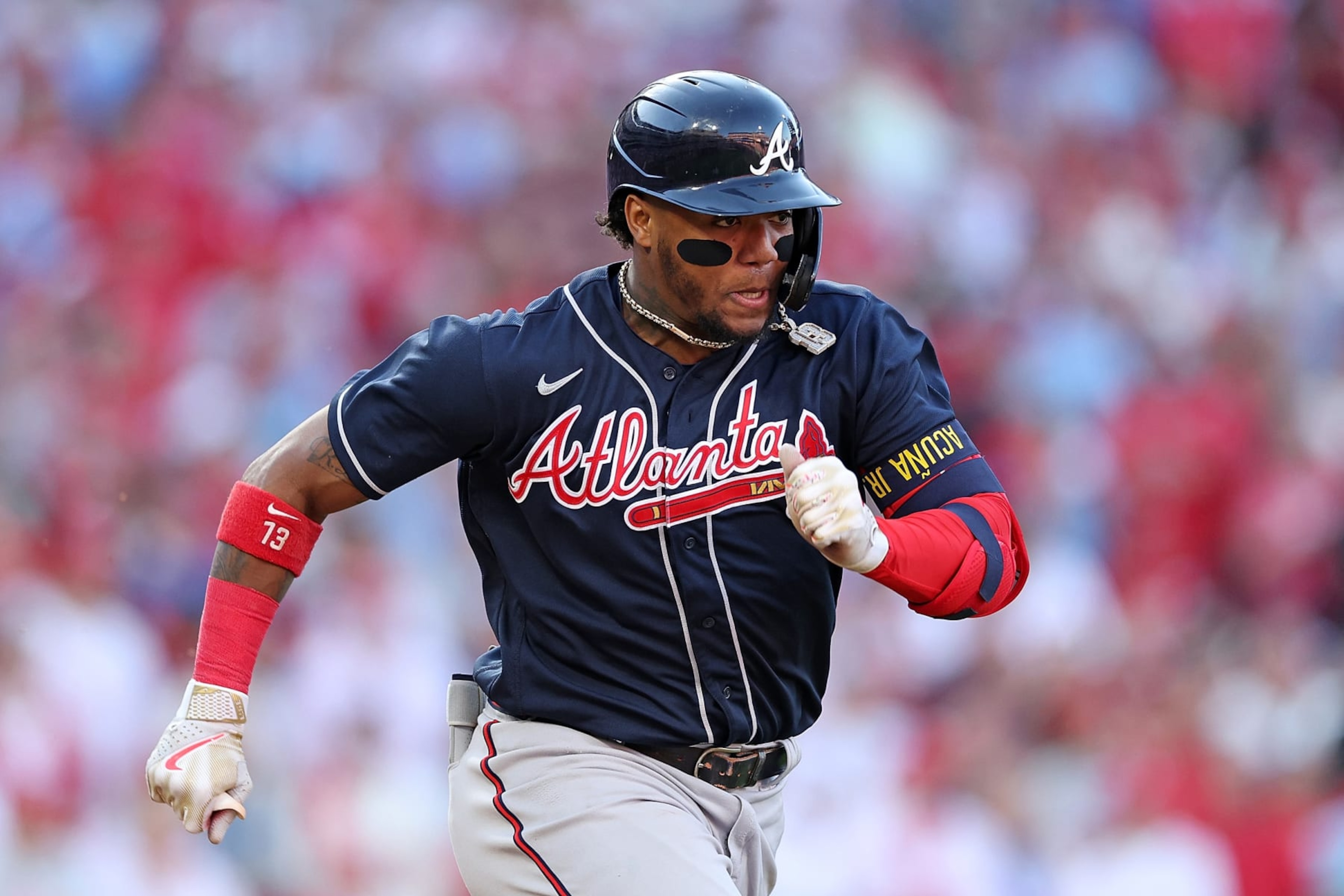 PHILADELPHIA, PENNSYLVANIA - OCTOBER 15: Ronald Acuna Jr. #13 of the Atlanta Braves runs to first base against the Philadelphia Phillies during the eighth inning in game four of the National League Division Series at Citizens Bank Park on October 15, 2022 in Philadelphia, Pennsylvania. (Photo by Patrick Smith/Getty Images)