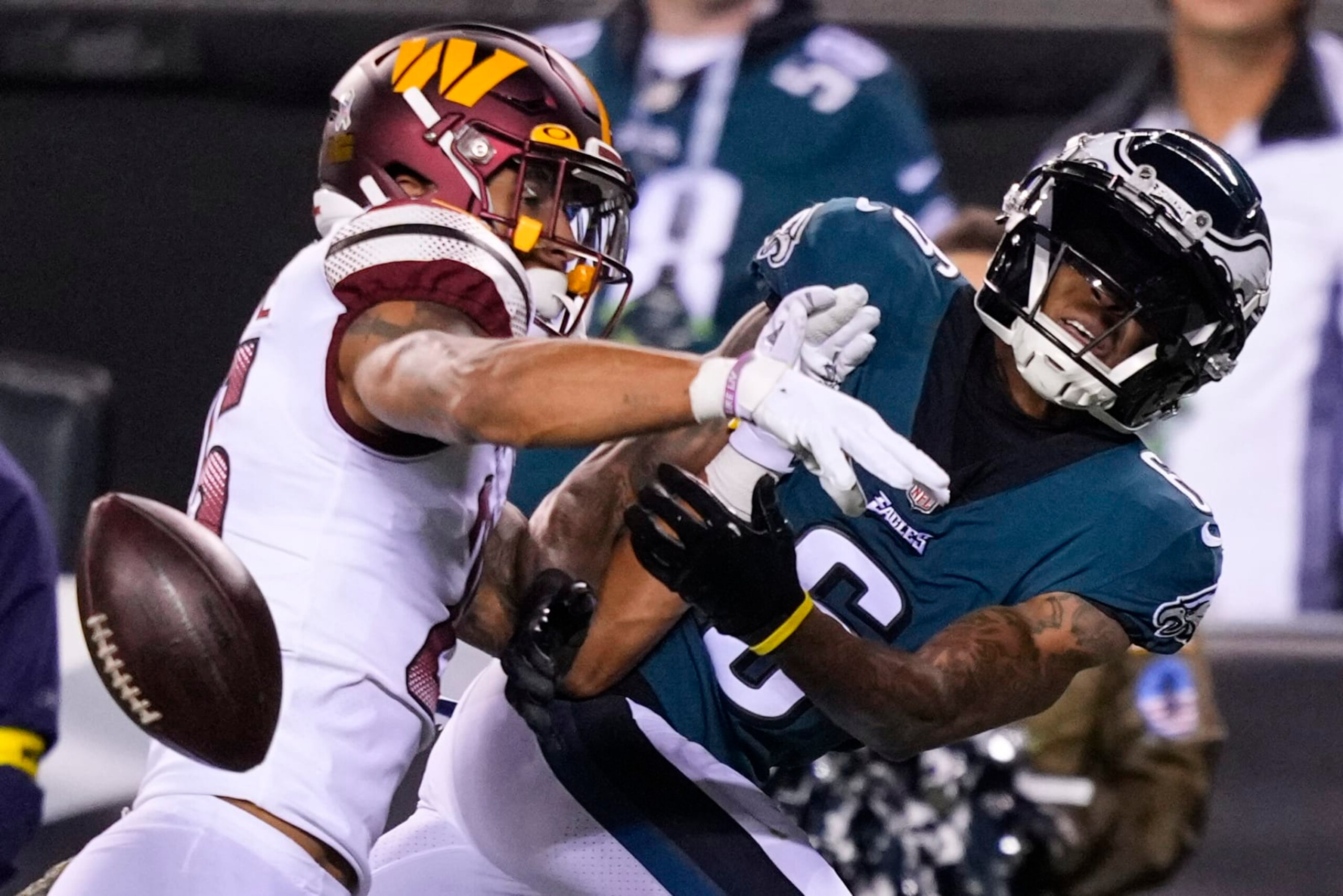 Philadelphia Eagles wide receiver DeVonta Smith (6) can't make the catch against Washington Commanders cornerback Benjamin St-Juste (25) during the first half of an NFL football game, Monday, Nov. 14, 2022, in Philadelphia. St-Juste was called for a penalty on the play. (AP Photo/Matt Slocum)