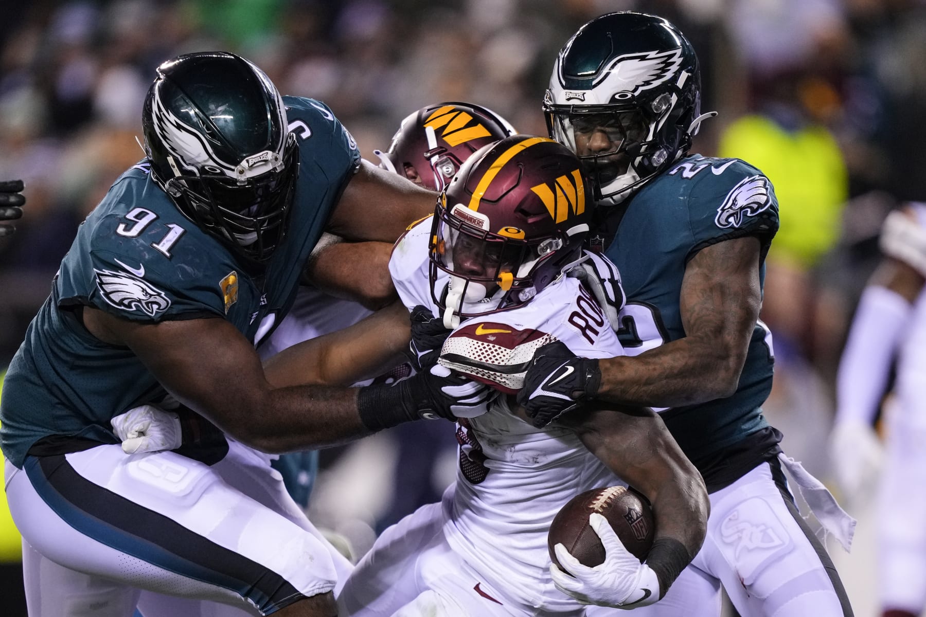 Washington Commanders running back Brian Robinson Jr. (8) runs into the end zone against Philadelphia Eagles defensive tackle Fletcher Cox (91) and Philadelphia Eagles safety C.J. Gardner-Johnson (23) during the first half of an NFL football game, Monday, Nov. 14, 2022, in Philadelphia. (AP Photo/Matt Slocum)