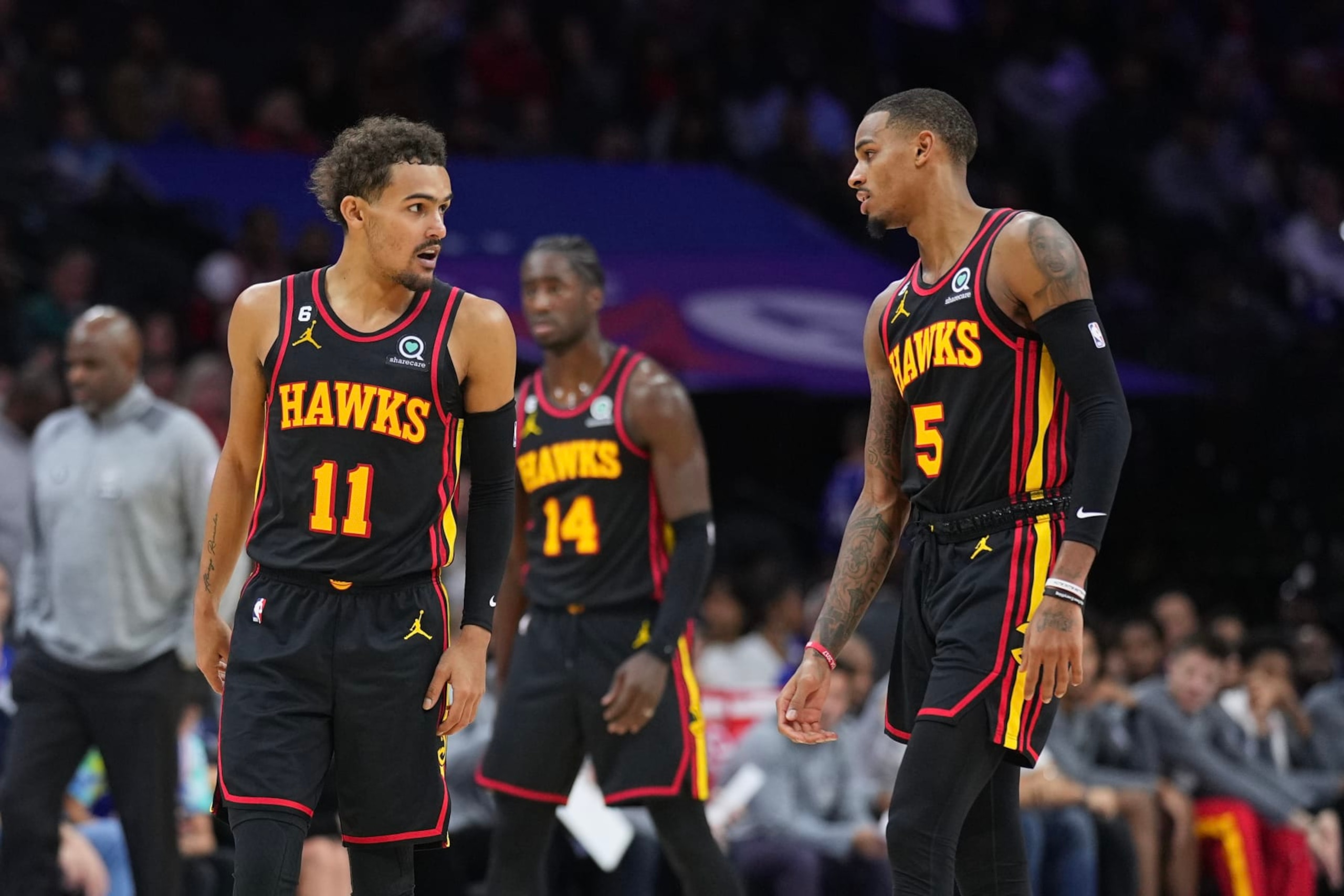 PHILADELPHIA, PA - NOVEMBER 12: Trae Young #11 and Dejounte Murray #5 of the Atlanta Hawks look on against the Philadelphia 76ers at the Wells Fargo Center on November 12, 2022 in Philadelphia, Pennsylvania. NOTE TO USER: User expressly acknowledges and agrees that, by downloading and or using this photograph, User is consenting to the terms and conditions of the Getty Images License Agreement. (Photo by Mitchell Leff/Getty Images)