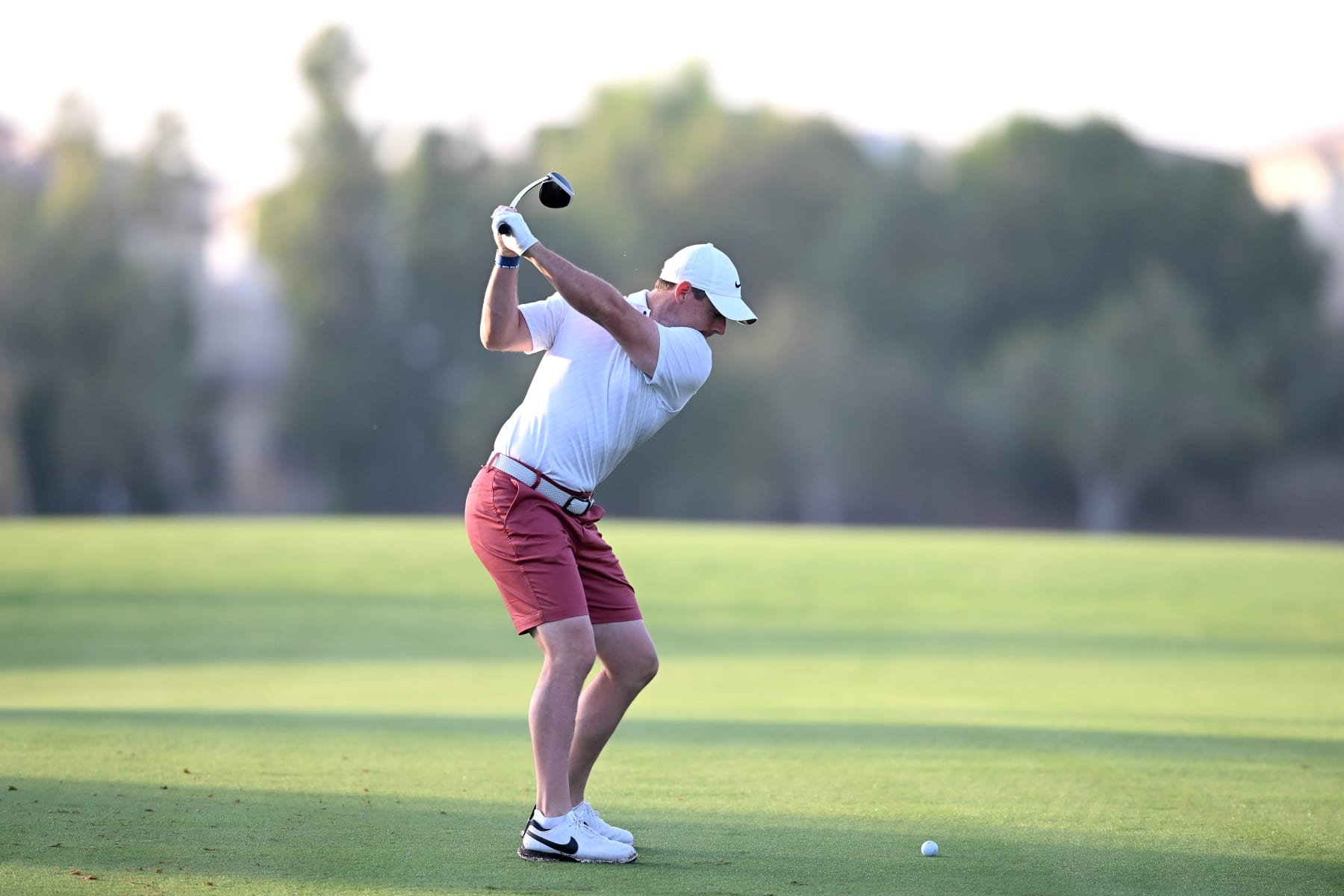 DUBAI, UNITED ARAB EMIRATES - NOVEMBER 15:  Rory McIlroy of Northern Ireland plays his second shot on the 2nd hole during the DP World Tour Championship - Rolex Pro-AM prior to the DP World Tour Championship on the Earth Course at Jumeirah Golf Estates on November 15, 2022 in Dubai, United Arab Emirates. (Photo by Ross Kinnaird/Getty Images)