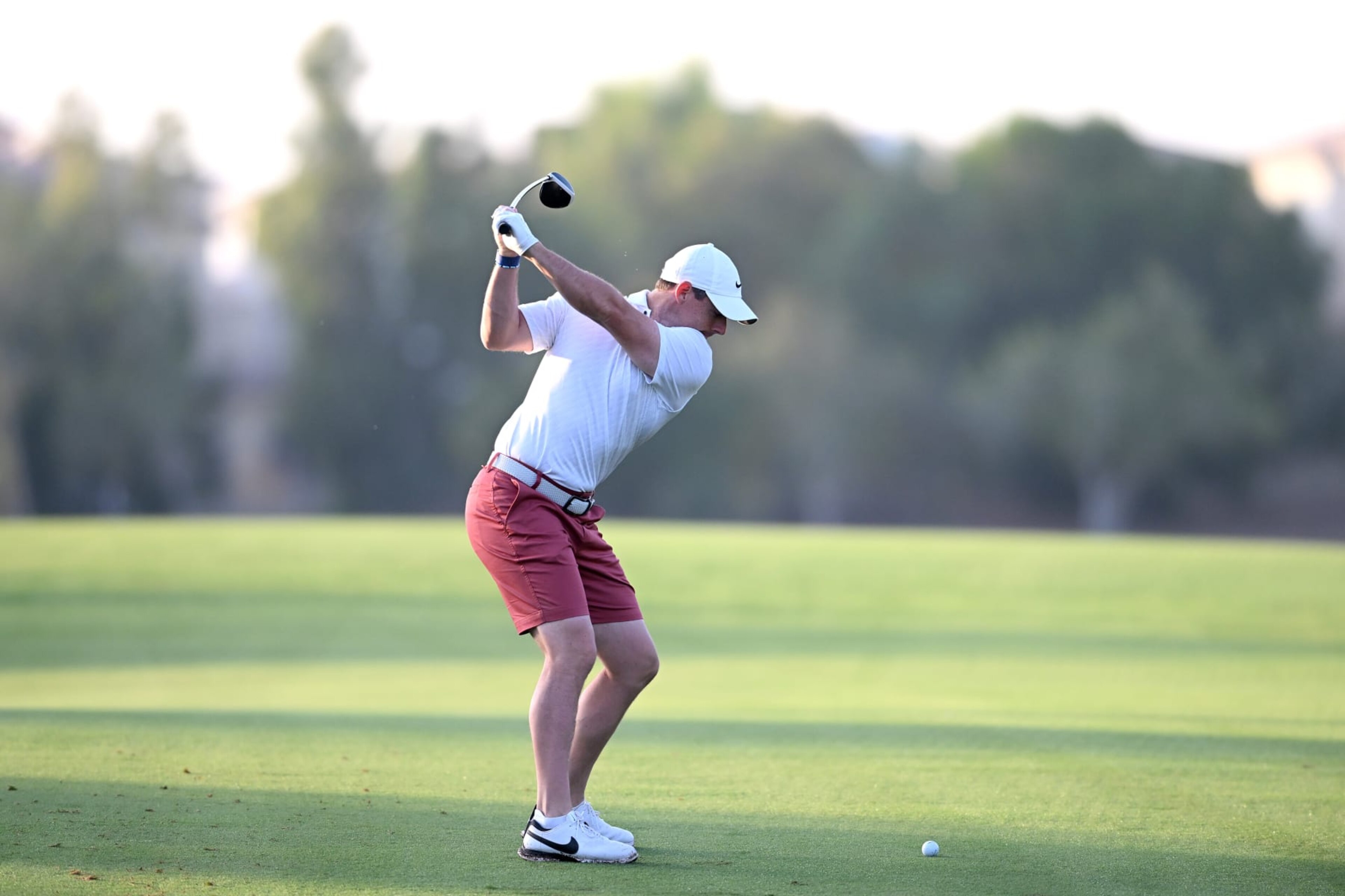DUBAI, UNITED ARAB EMIRATES - NOVEMBER 15:  Rory McIlroy of Northern Ireland plays his second shot on the 2nd hole during the DP World Tour Championship - Rolex Pro-AM prior to the DP World Tour Championship on the Earth Course at Jumeirah Golf Estates on November 15, 2022 in Dubai, United Arab Emirates. (Photo by Ross Kinnaird/Getty Images)
