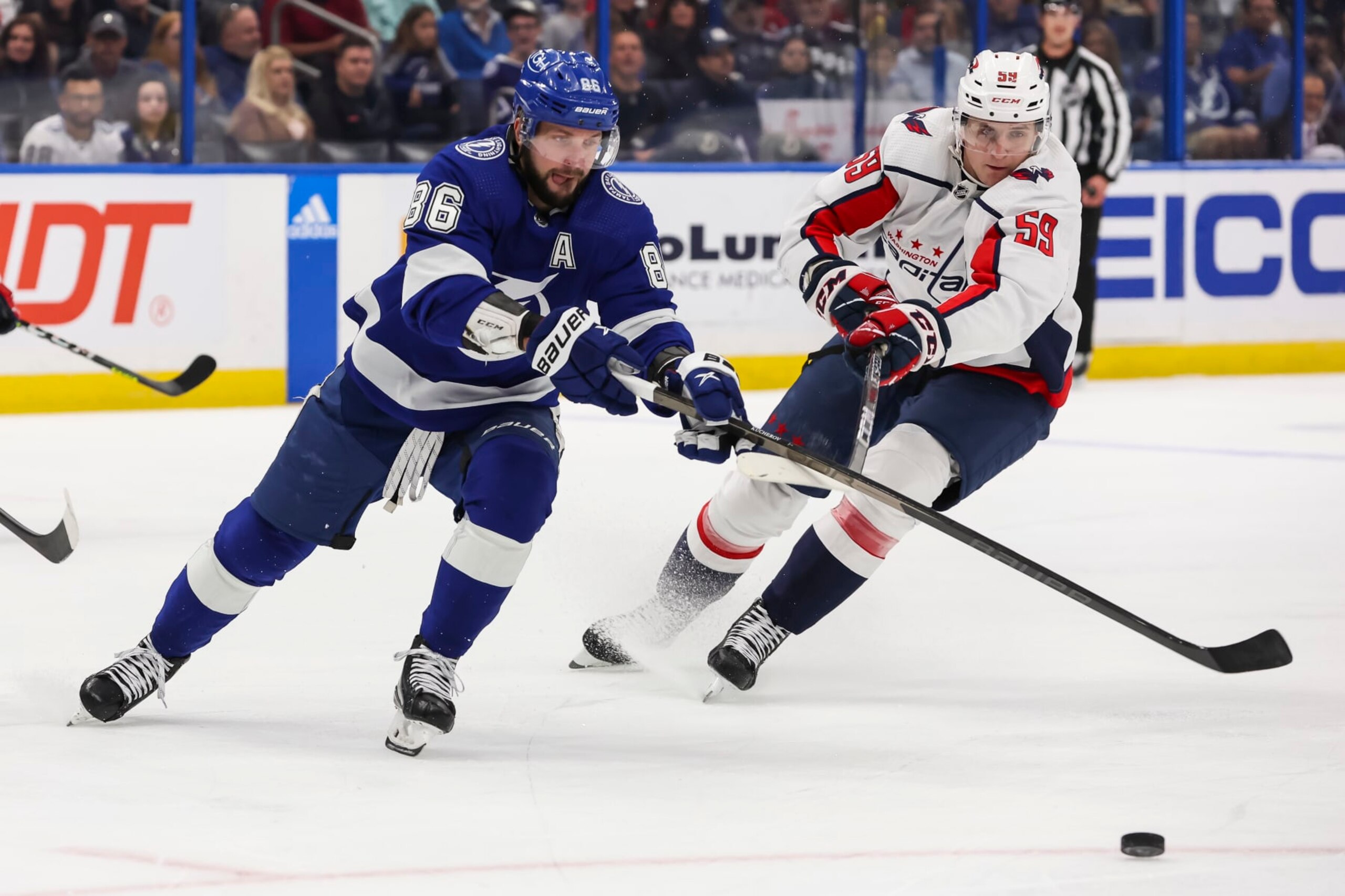 TAMPA, FL - NOVEMBER 13: Nikita Kucherov #86 of the Tampa Bay Lightning skates against Aliaksei Protas #59 of the Washington Capitals during the first period at Amalie Arena on November 13, 2022 in Tampa, Florida. (Photo by Mark LoMoglio/NHLI via Getty Images) TAMPA, FL - NOVEMBER 13: Nikita Kucherov #86 of the Tampa Bay Lightning skates against Aliaksei Protas #59 of the Washington Capitals during the first period at Amalie Arena on November 13, 2022 in Tampa, Florida. (Photo by Mark LoMoglio/NHLI via Getty Images)