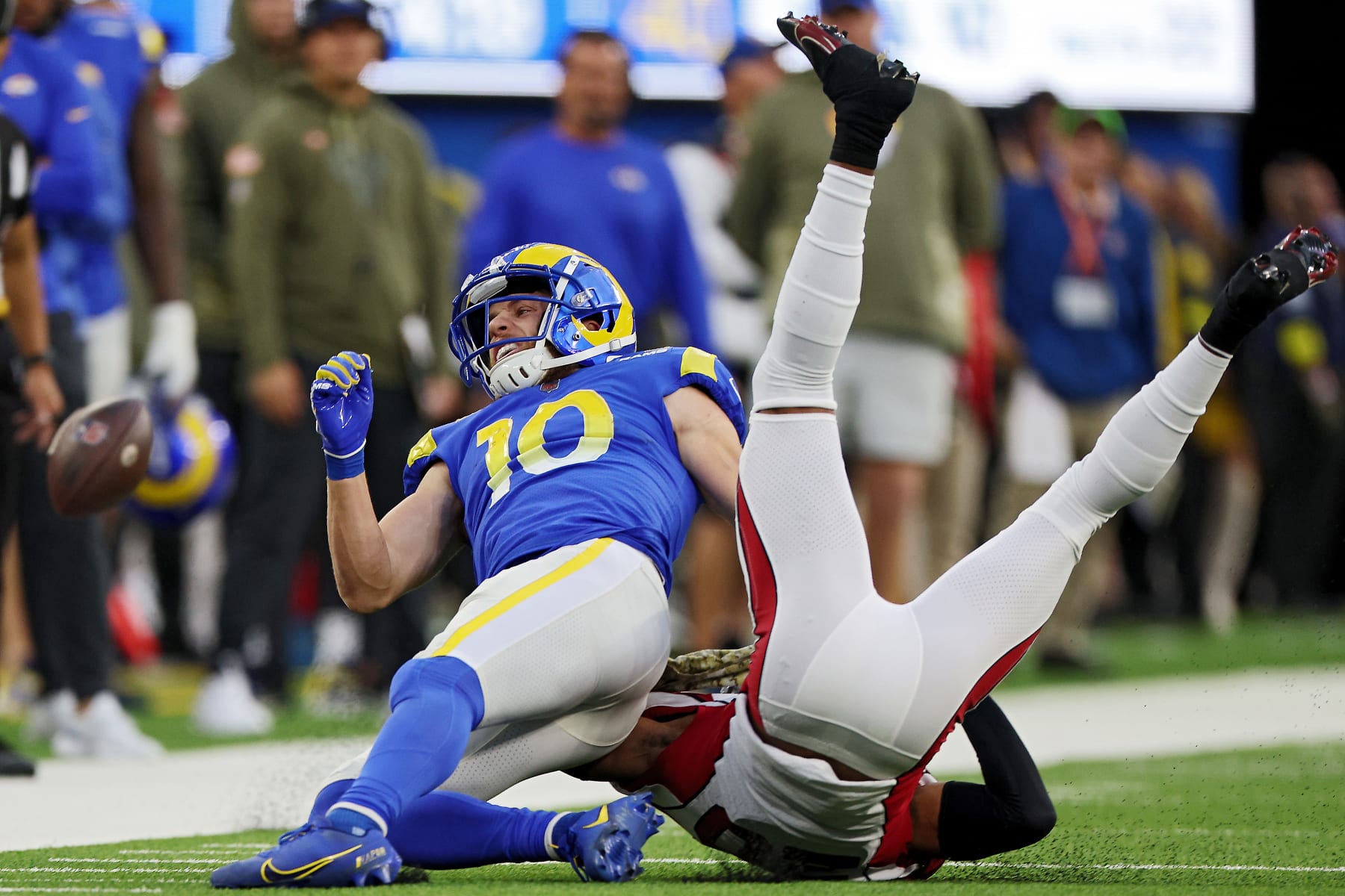 INGLEWOOD, CALIFORNIA - NOVEMBER 13: Cooper Kupp #10 of the Los Angeles Rams reacts after being hit by Marco Wilson #20 of the Arizona Cardinals in the fourth quarter of the game at SoFi Stadium on November 13, 2022 in Inglewood, California. (Photo by Harry How/Getty Images)