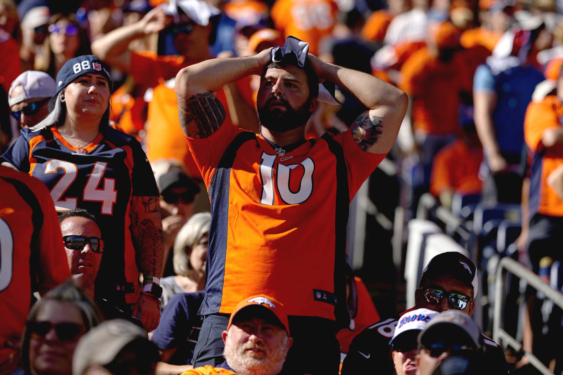 Denver Broncos fans react during the first half of an NFL football game against the Houston Texans, Sunday, Sept. 18, 2022, in Denver. (AP Photo/Jack Dempsey)