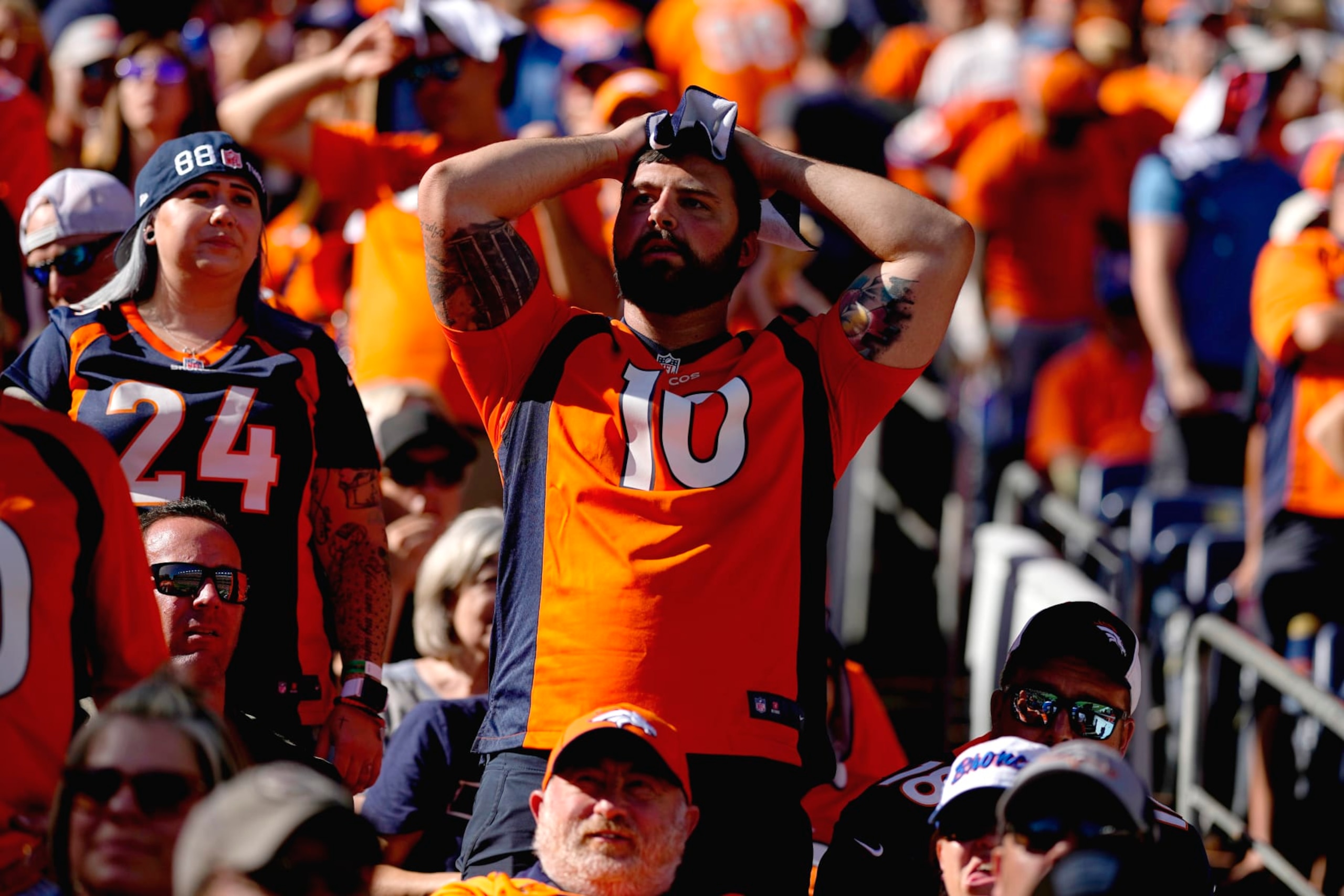 Denver Broncos fans react during the first half of an NFL football game against the Houston Texans, Sunday, Sept. 18, 2022, in Denver. (AP Photo/Jack Dempsey) Denver Broncos fans react during the first half of an NFL football game against the Houston Texans, Sunday, Sept. 18, 2022, in Denver. (AP Photo/Jack Dempsey)