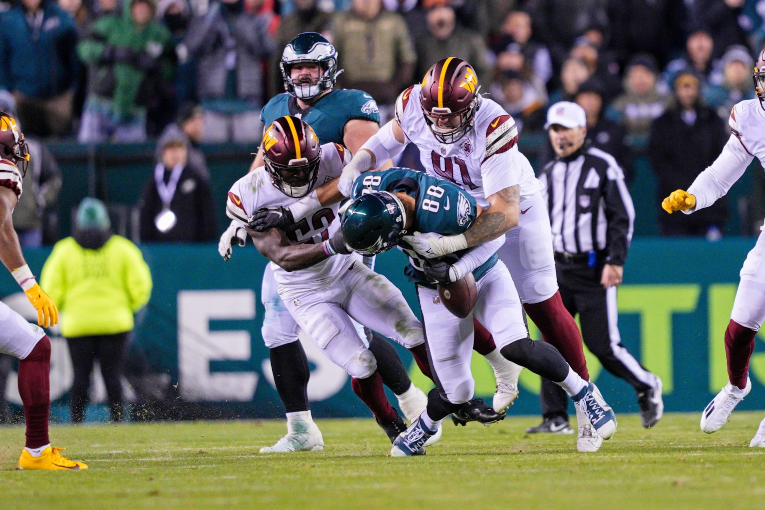 PHILADELPHIA, PA - NOVEMBER 14: Philadelphia Eagles tight end Dallas Goedert (88) fumbles after being face masked by Washington Commanders linebacker Jamin Davis (52) during the game between the Washington Commanders and the Philadelphia Eagles on November 14, 2022 at Lincoln Financial Field in Philadelphia, PA. (Photo by Andy Lewis/Icon Sportswire via Getty Images) PHILADELPHIA, PA - NOVEMBER 14: Philadelphia Eagles tight end Dallas Goedert (88) fumbles after being face masked by Washington Commanders linebacker Jamin Davis (52) during the game between the Washington Commanders and the Philadelphia Eagles on November 14, 2022 at Lincoln Financial Field in Philadelphia, PA. (Photo by Andy Lewis/Icon Sportswire via Getty Images)