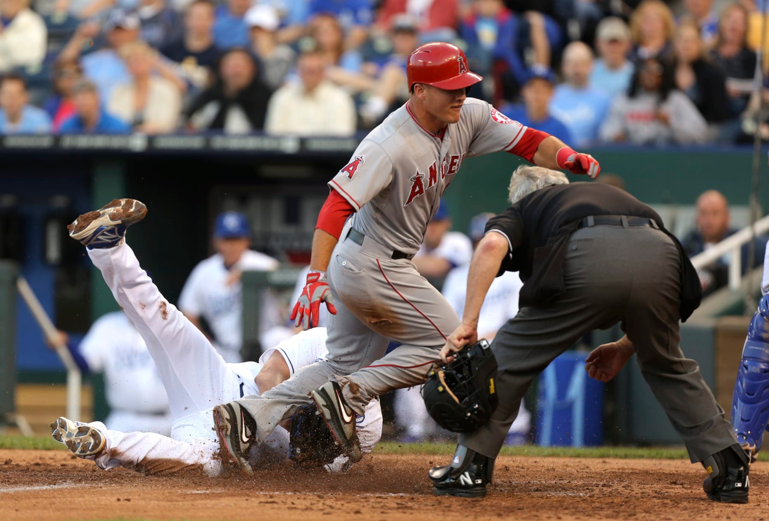 KANSAS CITY, MO - MAY 24: Mike Trout #27 of the Los Angeles Angels of Anaheim crosses home past starting pitcher Luis Mendoza #39 of the Kansas City Royals as he scores on a wild pitch in the third inning at Kauffman Stadium on May 24, 2012 in Kansas City, Missouri. (Photo by Ed Zurga/Getty Images) KANSAS CITY, MO - MAY 24: Mike Trout #27 of the Los Angeles Angels of Anaheim crosses home past starting pitcher Luis Mendoza #39 of the Kansas City Royals as he scores on a wild pitch in the third inning at Kauffman Stadium on May 24, 2012 in Kansas City, Missouri. (Photo by Ed Zurga/Getty Images)