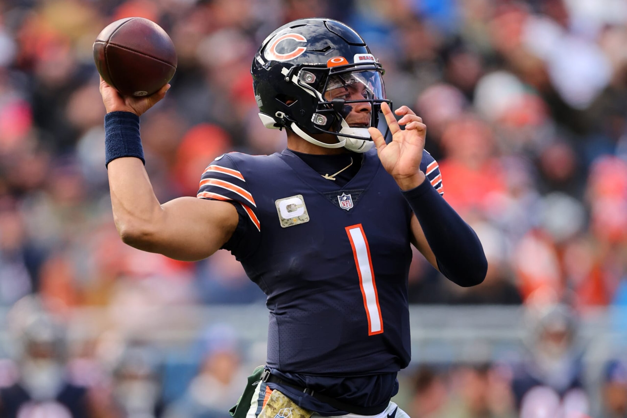 CHICAGO, ILLINOIS - NOVEMBER 13: Justin Fields #1 of the Chicago Bears attempts a pass during the second quarter against the Detroit Lions at Soldier Field on November 13, 2022 in Chicago, Illinois. (Photo by Michael Reaves/Getty Images)