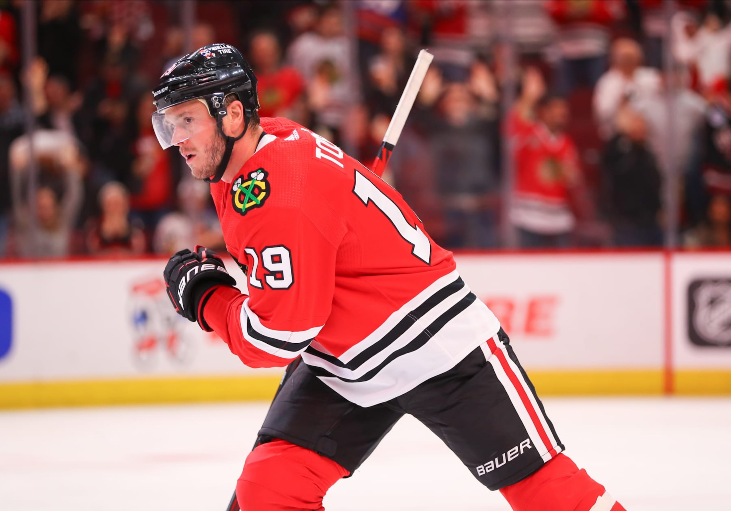 CHICAGO, IL - NOVEMBER 01: Chicago Blackhawks center Jonathan Toews (19) skates back to the bench after scoring a goal during a game between the New York Islanders and the Chicago Blackhawks on November 1, 2022 at the United Center in Chicago, IL. (Photo by Melissa Tamez/Icon Sportswire via Getty Images)